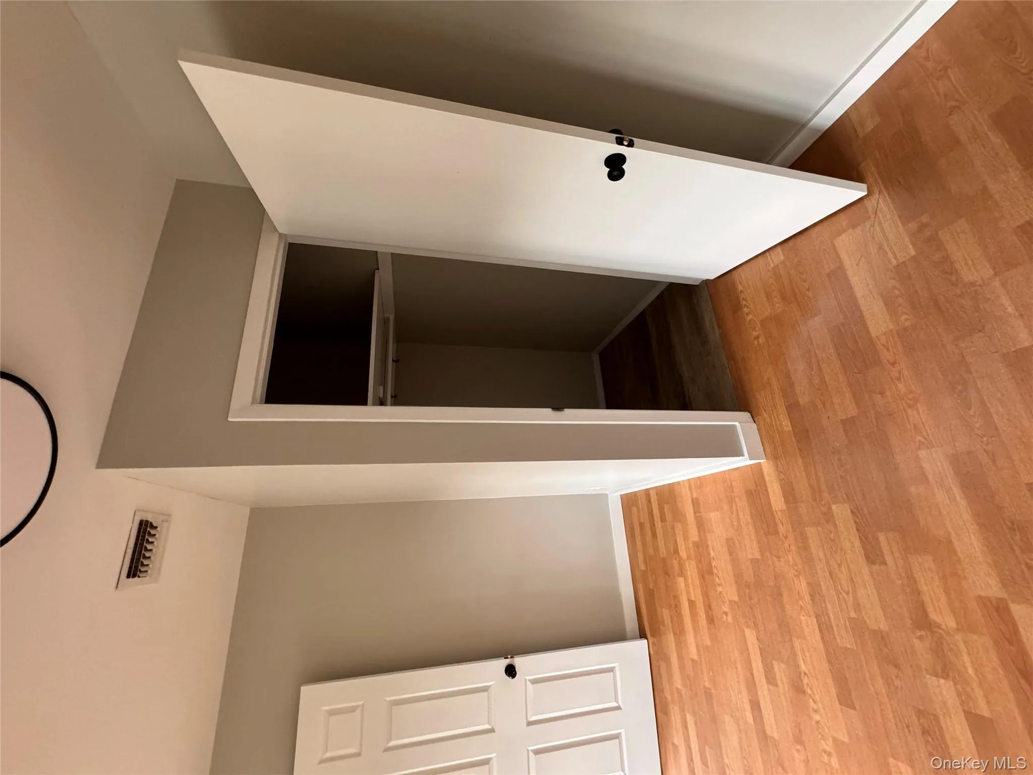 Unfurnished bedroom with light wood-style flooring and a closet Unfurnished bedroom with light wood-style flooring and a closet