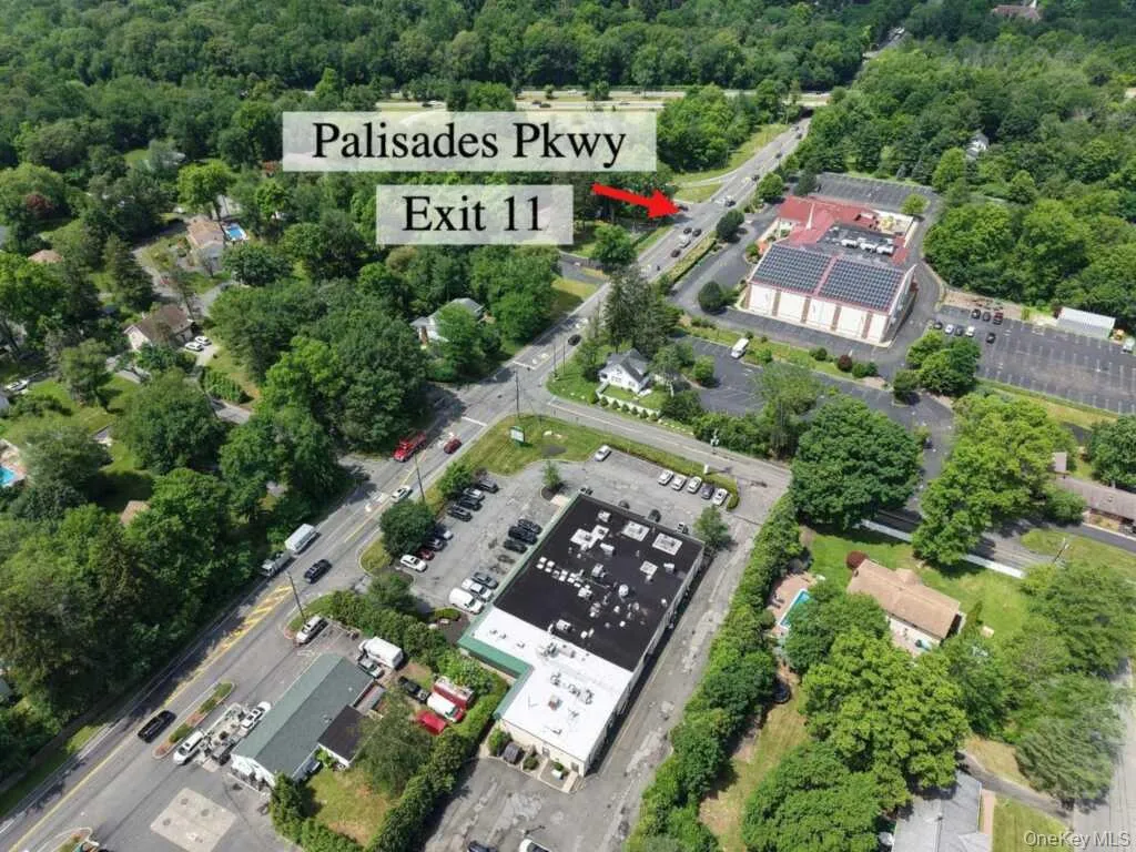 Aerial view of property and surrounding area featuring a forest Aerial view of property and surrounding area featuring a forest