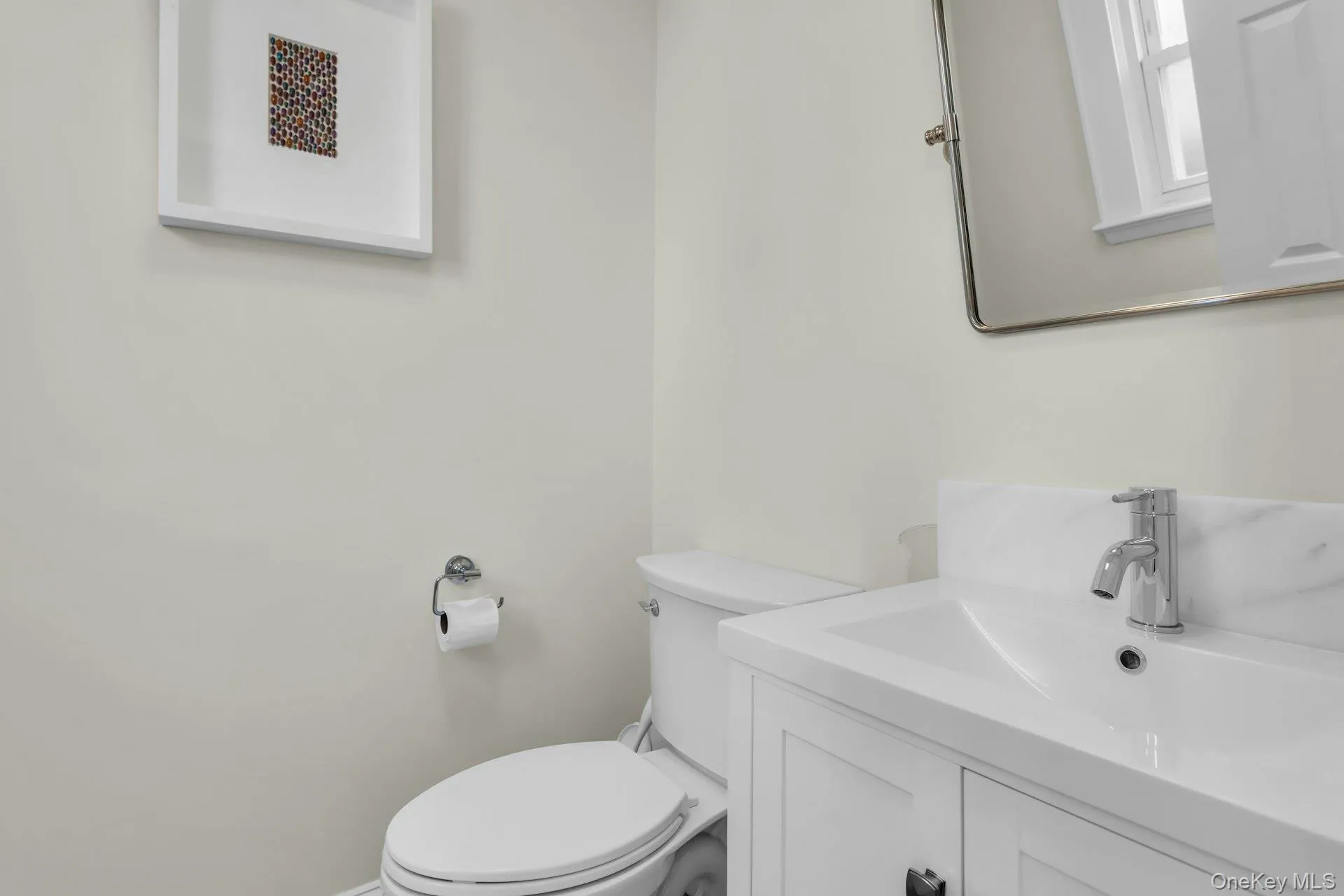 Bathroom with toilet and vanity Bathroom with toilet and vanity