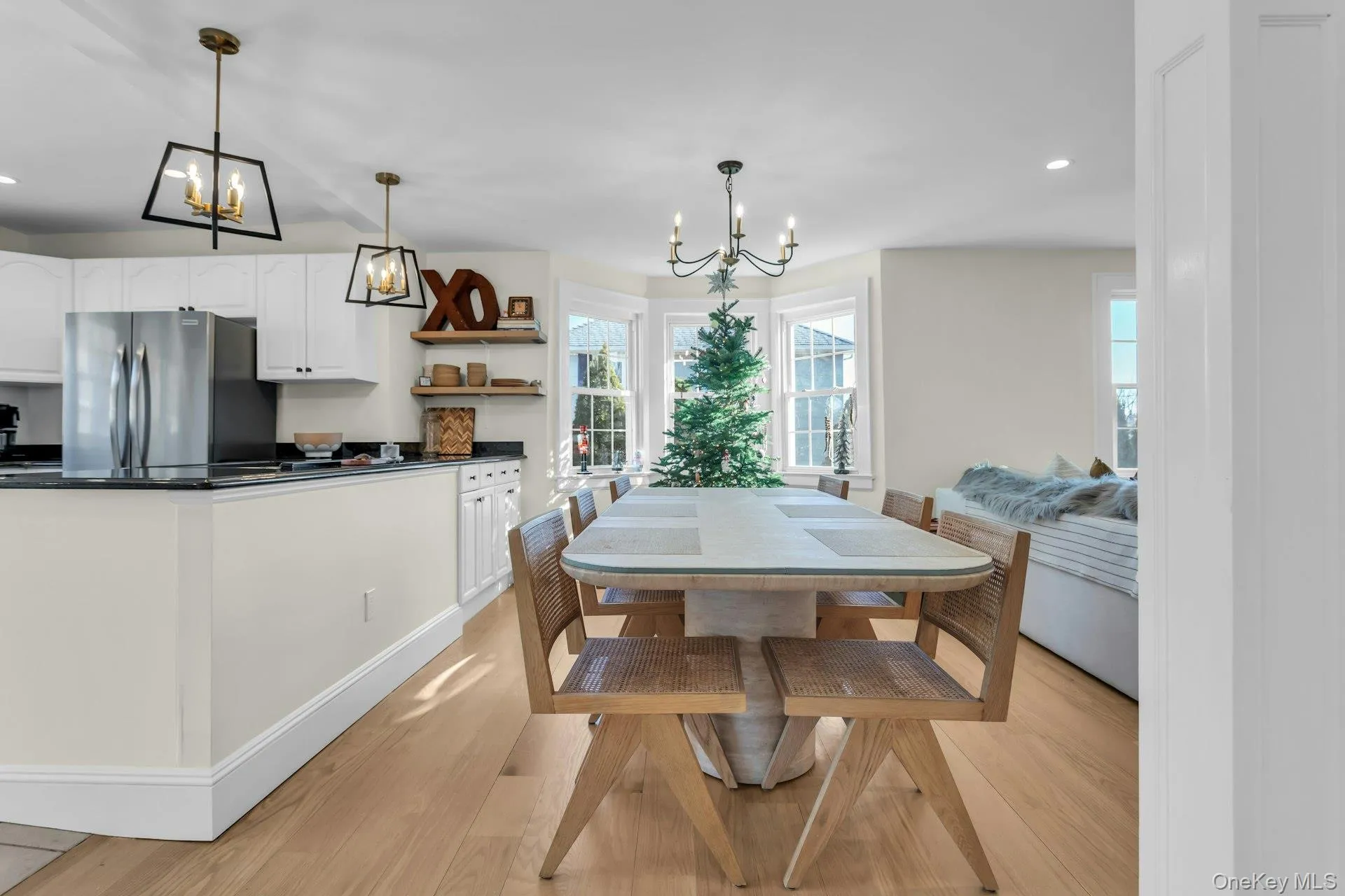 Dining space featuring a chandelier, recessed lighting, and light wood-style floors Dining space featuring a chandelier, recessed lighting, and light wood-style floors