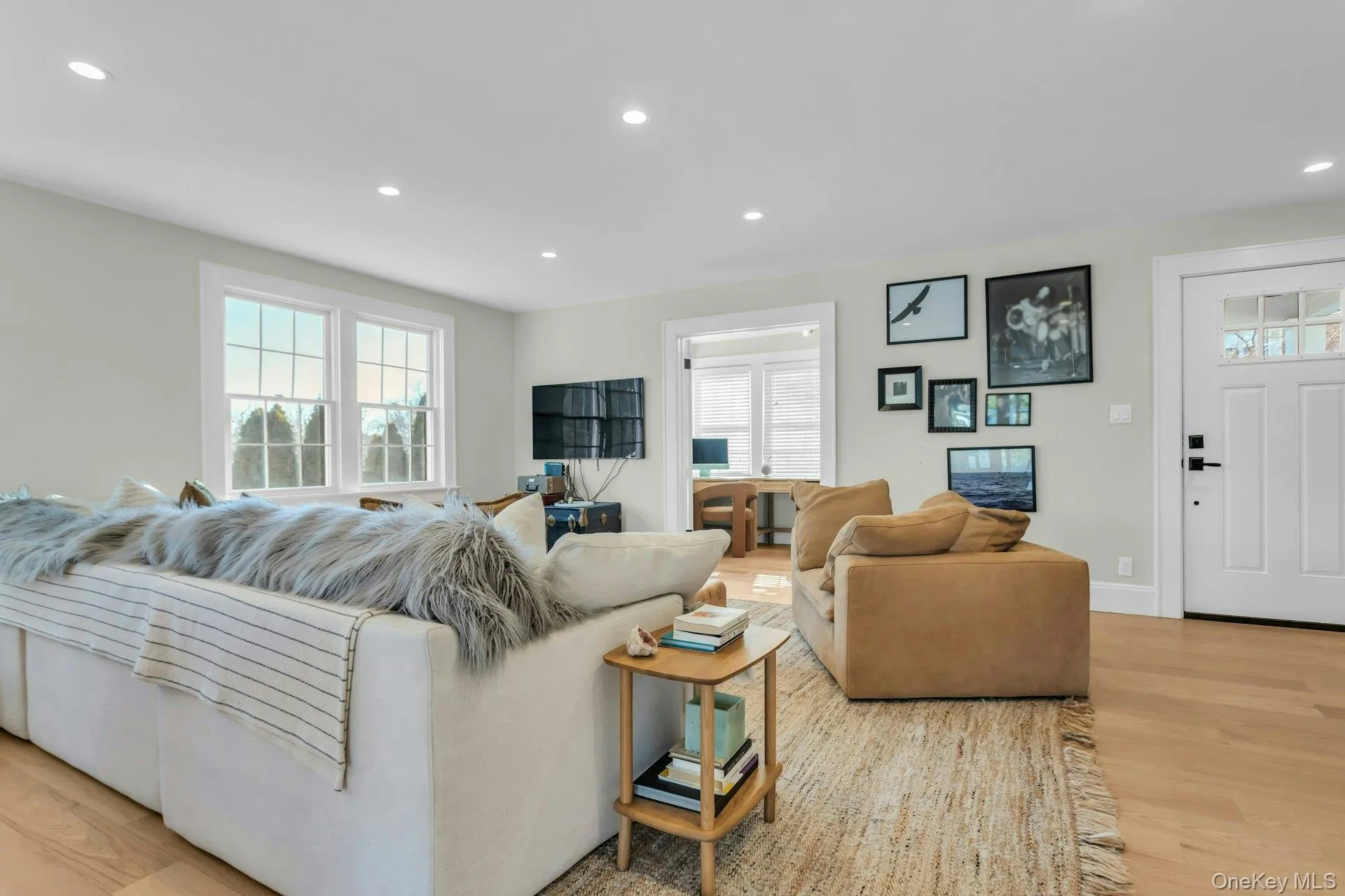 Living area featuring light wood-style flooring, recessed lighting, and healthy amount of natural light Living area featuring light wood-style flooring, recessed lighting, and healthy amount of natural light