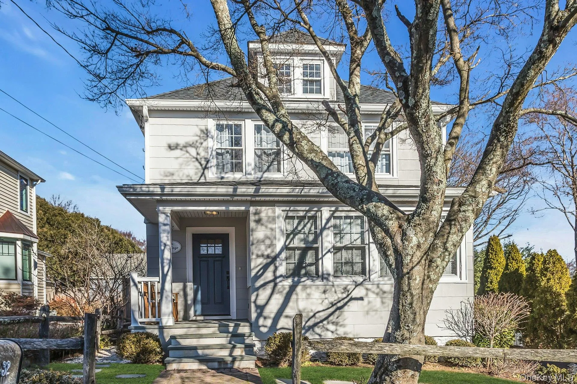 View of front of home with a shingled roof View of front of home with a shingled roof