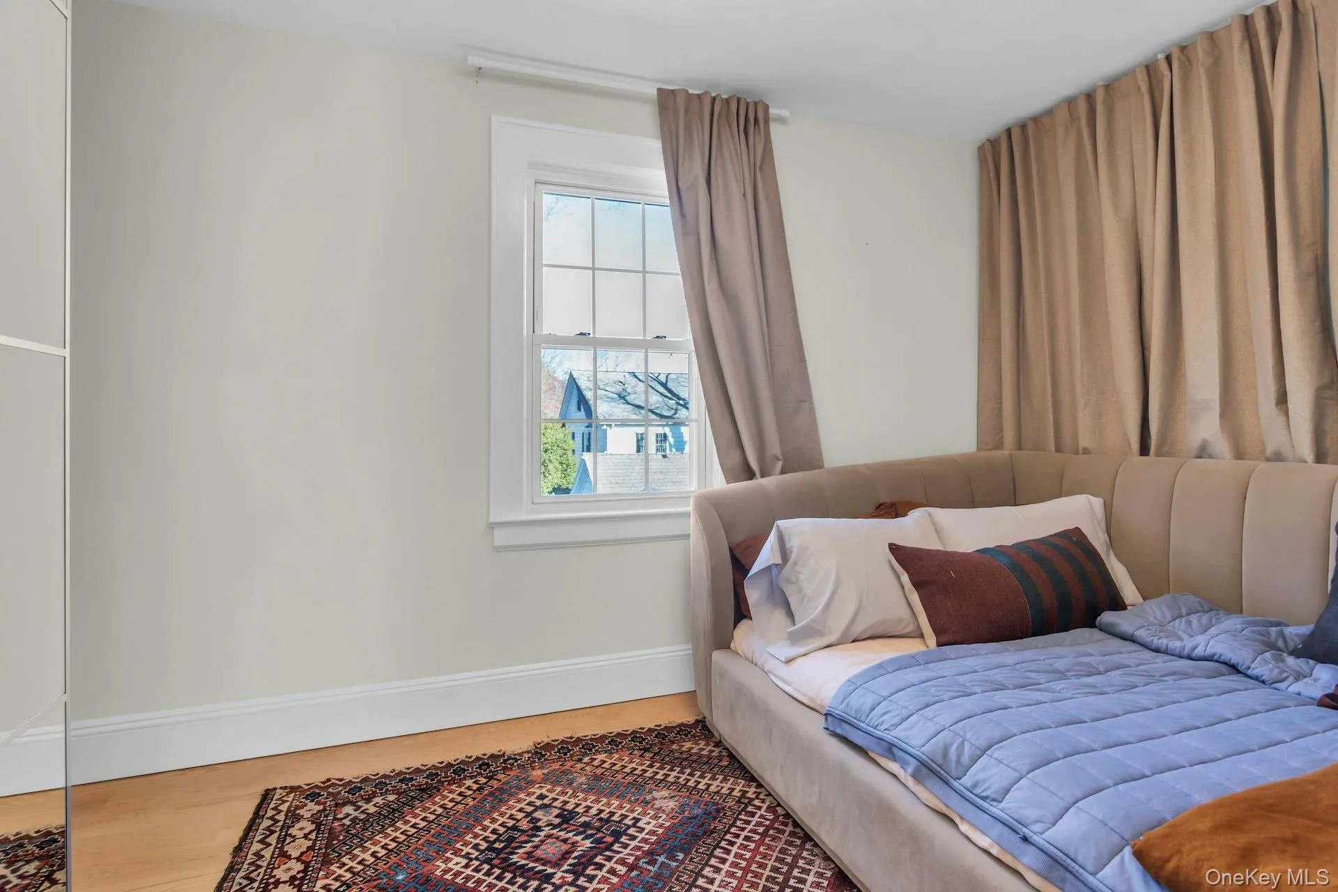 Bedroom with baseboards and wood finished floors Bedroom with baseboards and wood finished floors