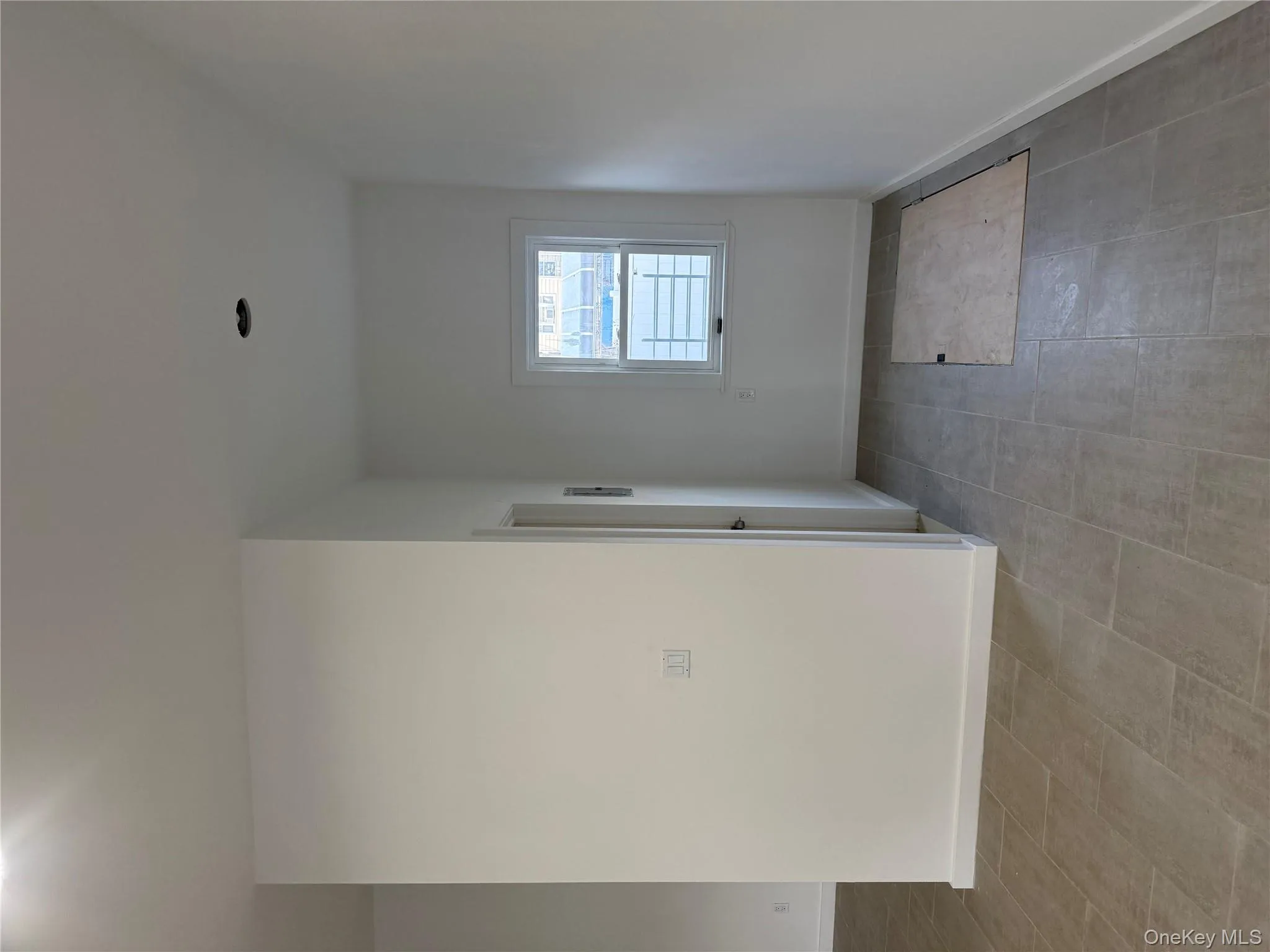 Empty room with baseboards Empty room with baseboards