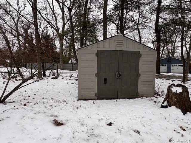 Snow covered structure with a storage unit Snow covered structure with a storage unit