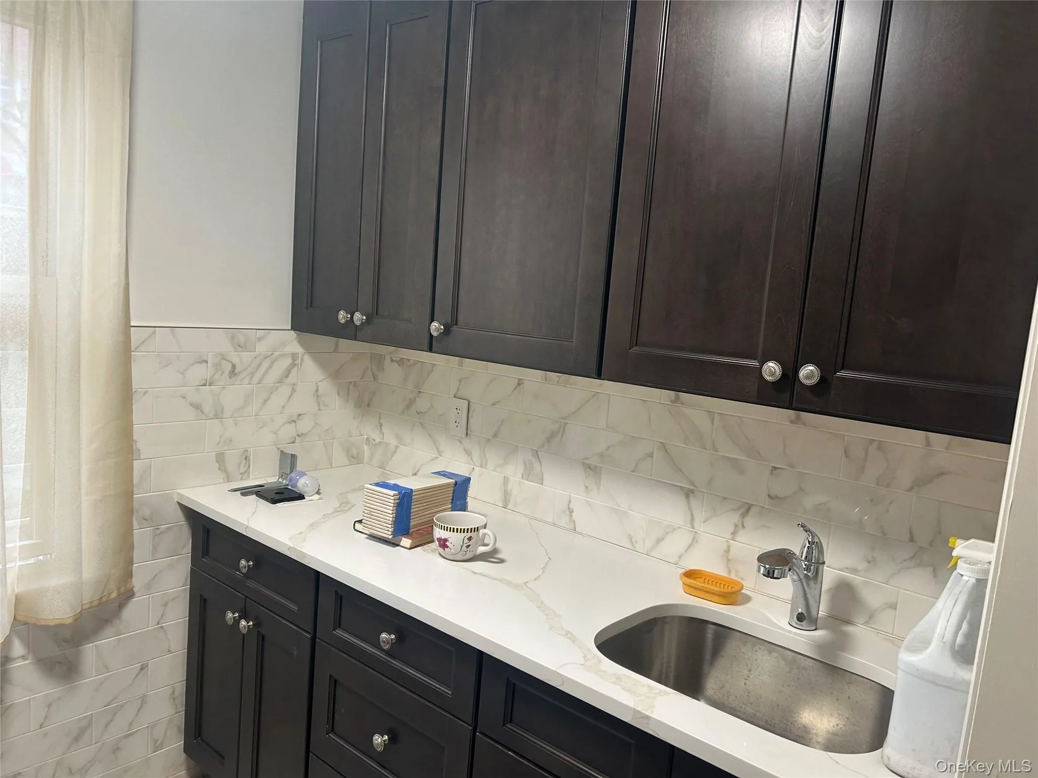 Kitchen with light stone counters Kitchen with light stone counters
