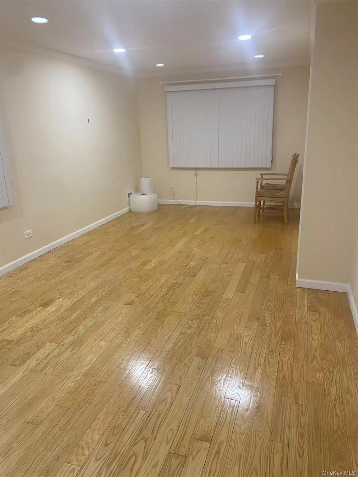 Spare room with light wood-style floors and recessed lighting Spare room with light wood-style floors and recessed lighting