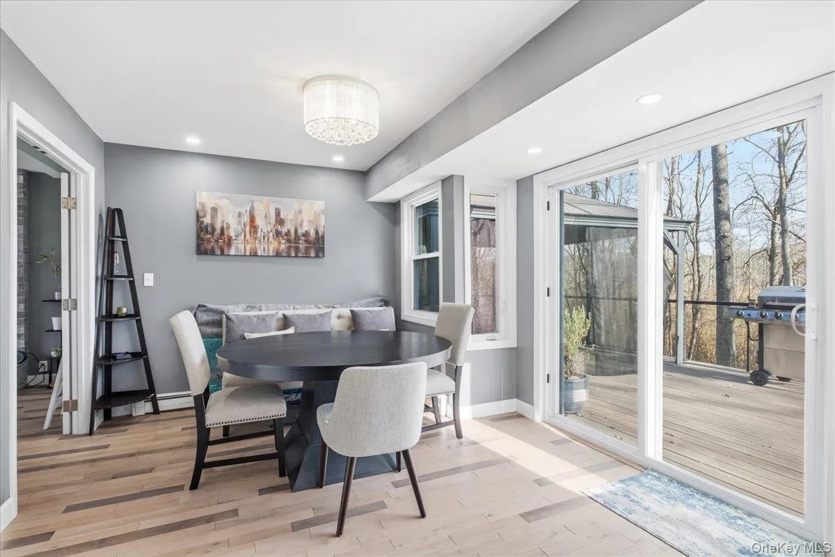 Dining room featuring light wood finished floors and recessed lighting Dining room featuring light wood finished floors and recessed lighting