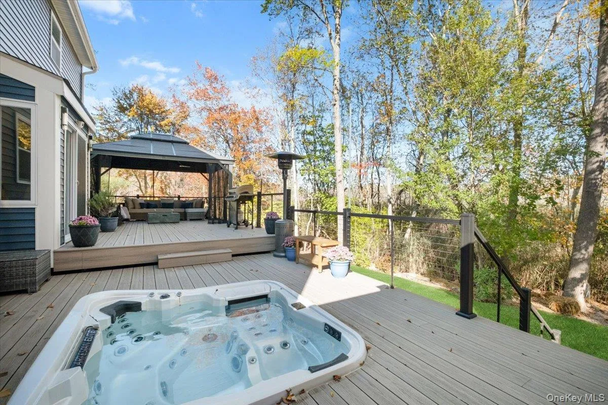 Deck with a gazebo and outdoor lounge area Deck with a gazebo and outdoor lounge area