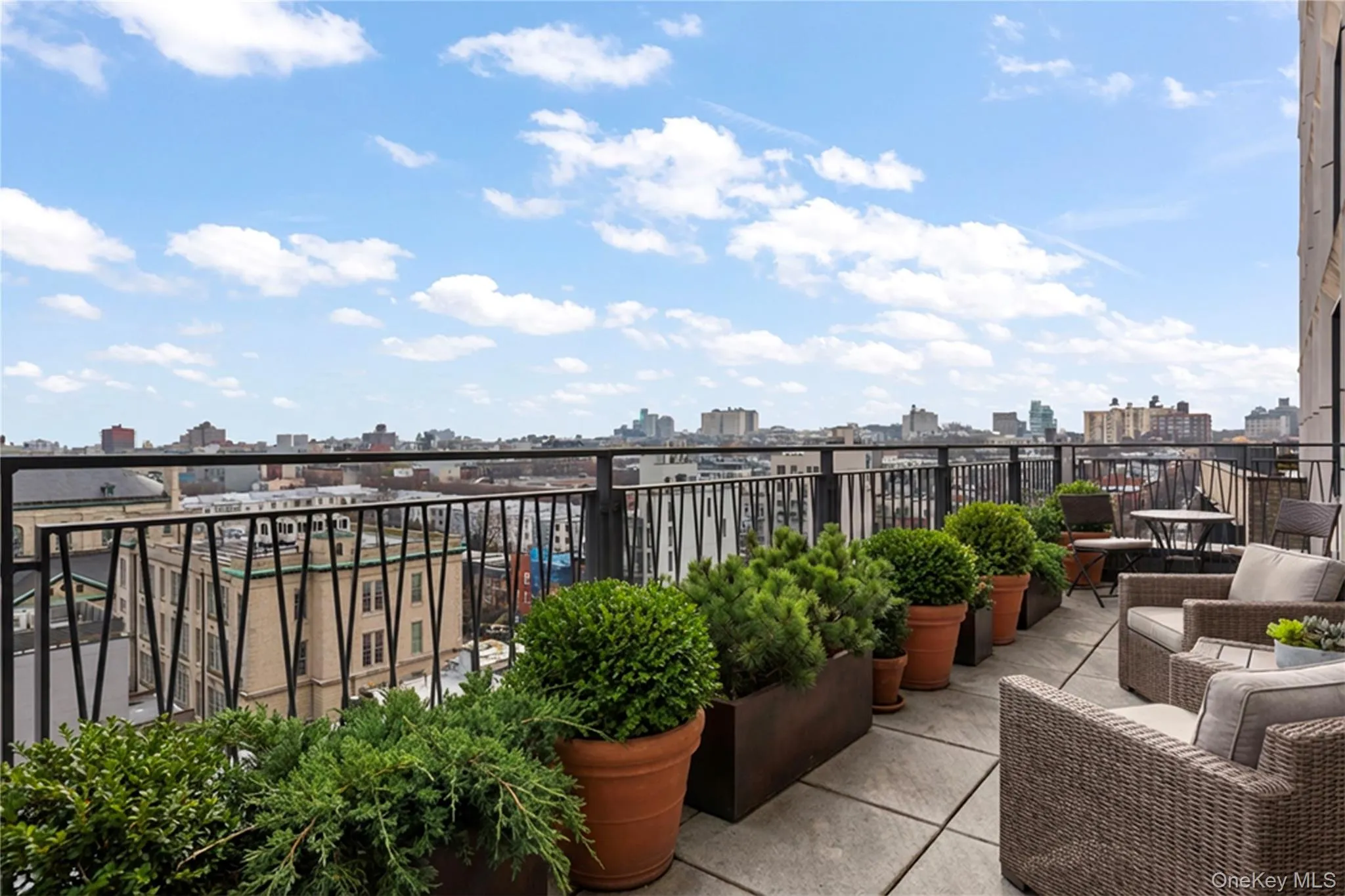 Balcony featuring a skyline view Balcony featuring a skyline view