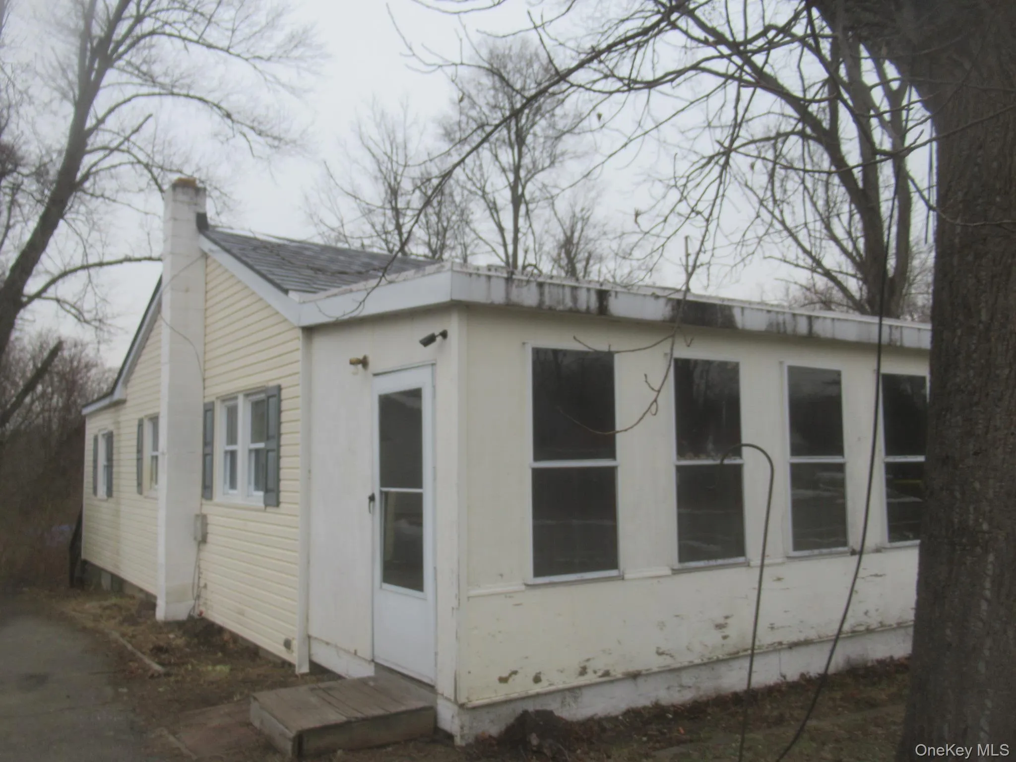 View of side of property featuring a chimney View of side of property featuring a chimney