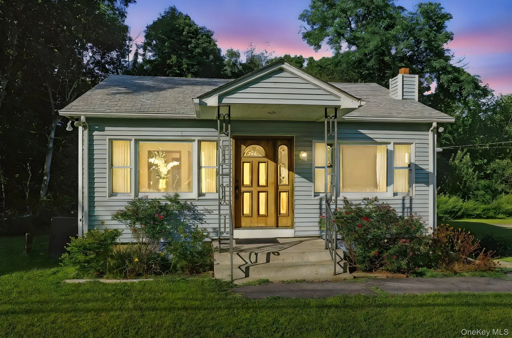 Bungalow-style home featuring a front yard, a chimney, and roof with shingles Bungalow-style home featuring a front yard, a chimney, and roof with shingles