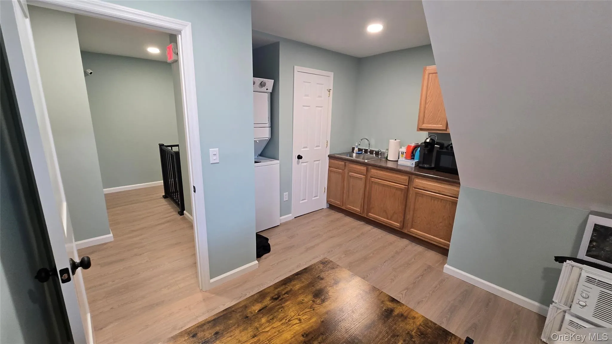 Shared lounge with access to sink, microwave, and fridge. Shared lounge with access to sink, microwave, and fridge.