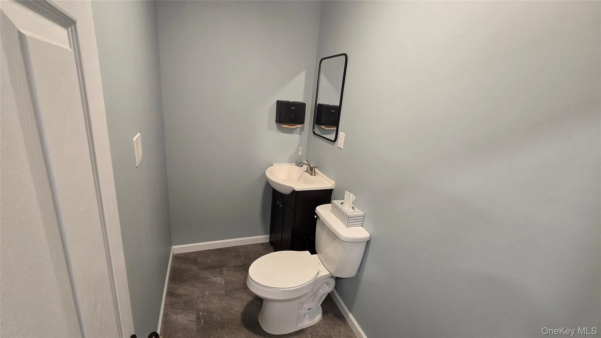 Half bathroom featuring vanity Half bathroom featuring vanity