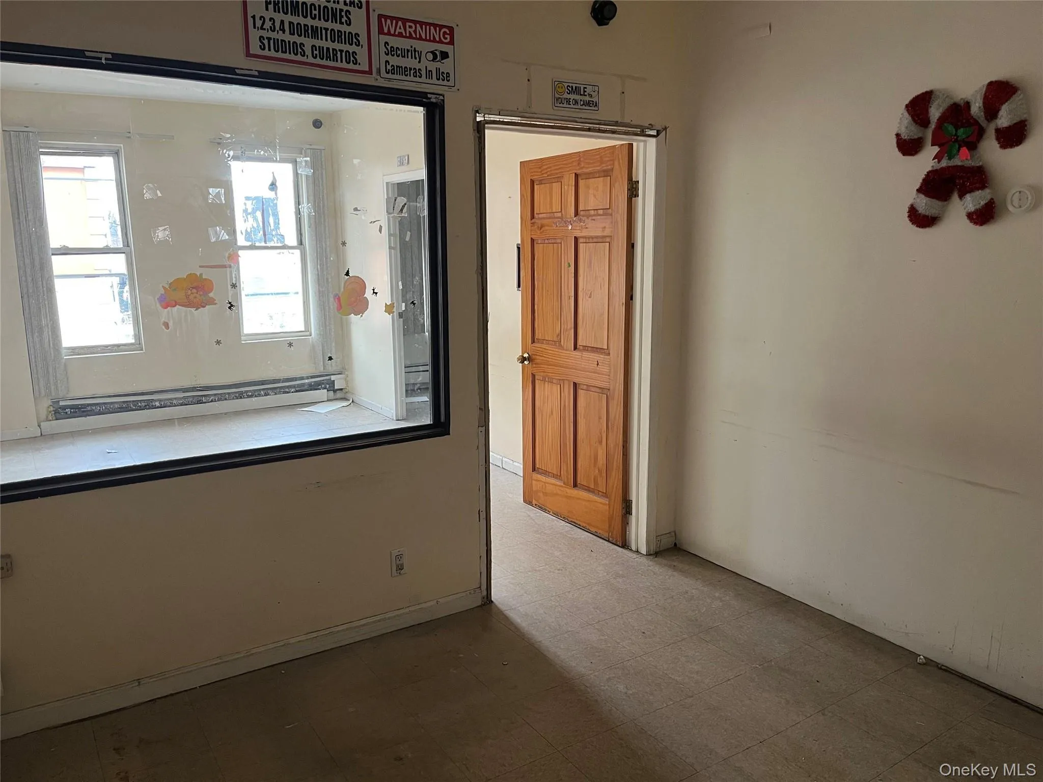 Unfurnished room with tile patterned floors Unfurnished room with tile patterned floors