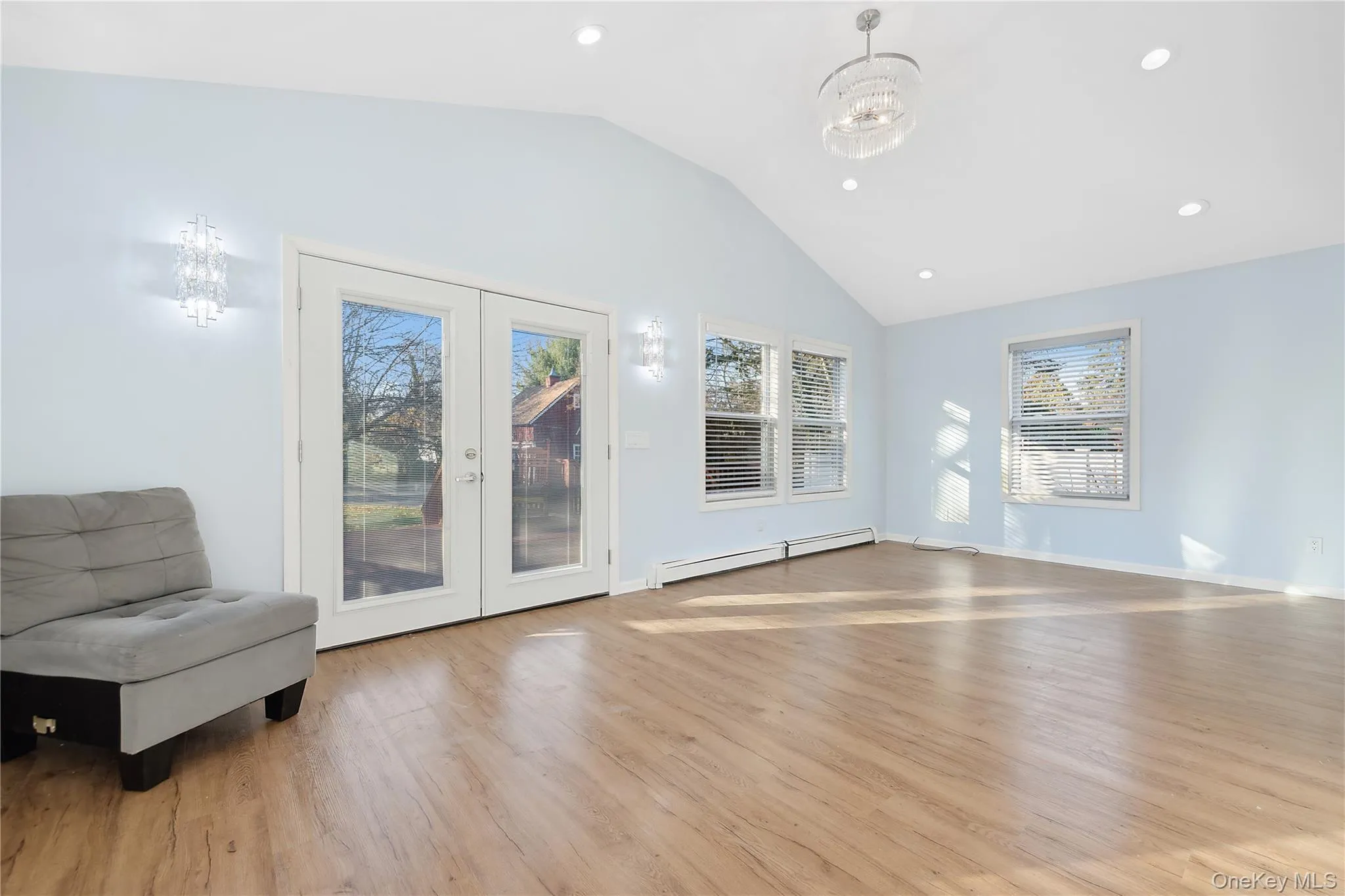 Vaulted ceiling, French doors to outside deck and yard. Vaulted ceiling, French doors to outside deck and yard.