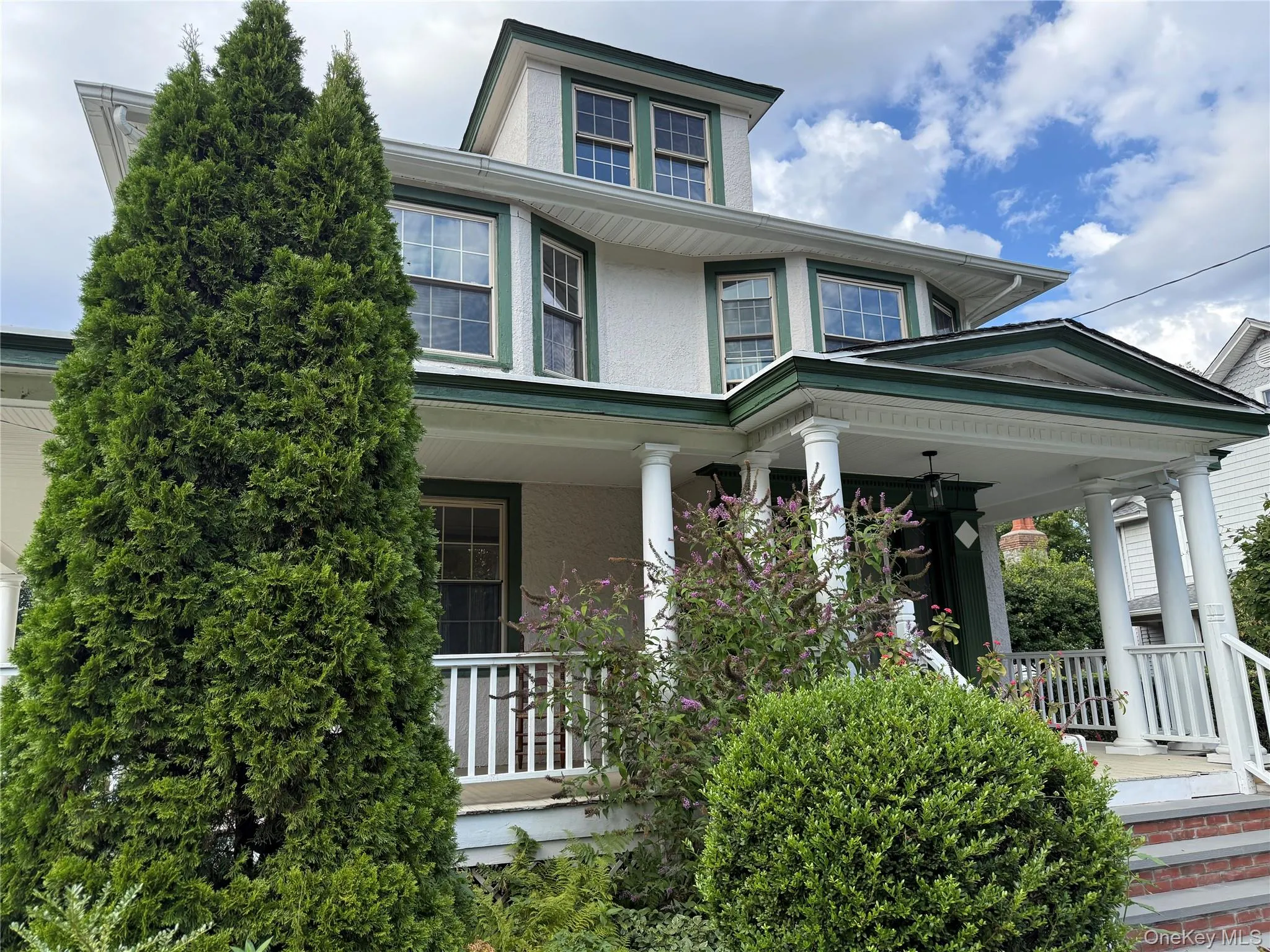 View of front of property featuring a porch and stucco siding View of front of property featuring a porch and stucco siding