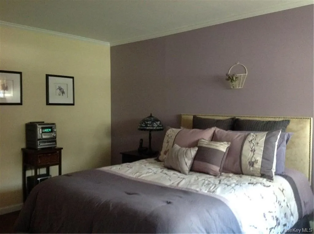 Bedroom with ornamental molding Bedroom with ornamental molding