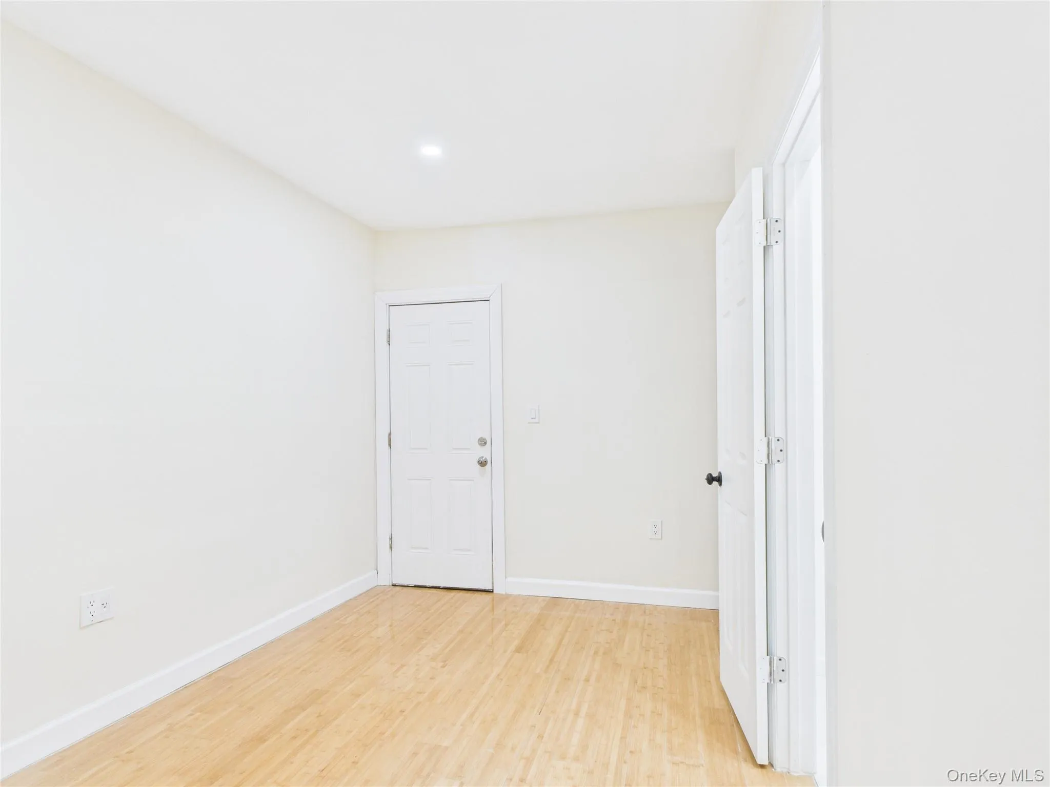 Empty room featuring light wood-style floors and recessed lighting Empty room featuring light wood-style floors and recessed lighting