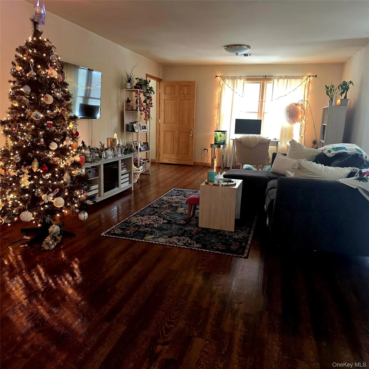 Living area featuring dark wood-style floors Living area featuring dark wood-style floors