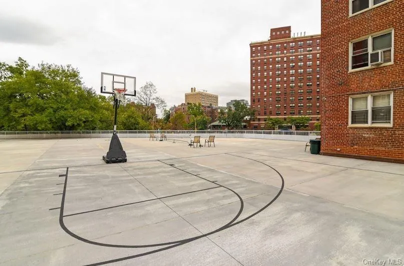 View of basketball court with community basketball court and a patio View of basketball court with community basketball court and a patio