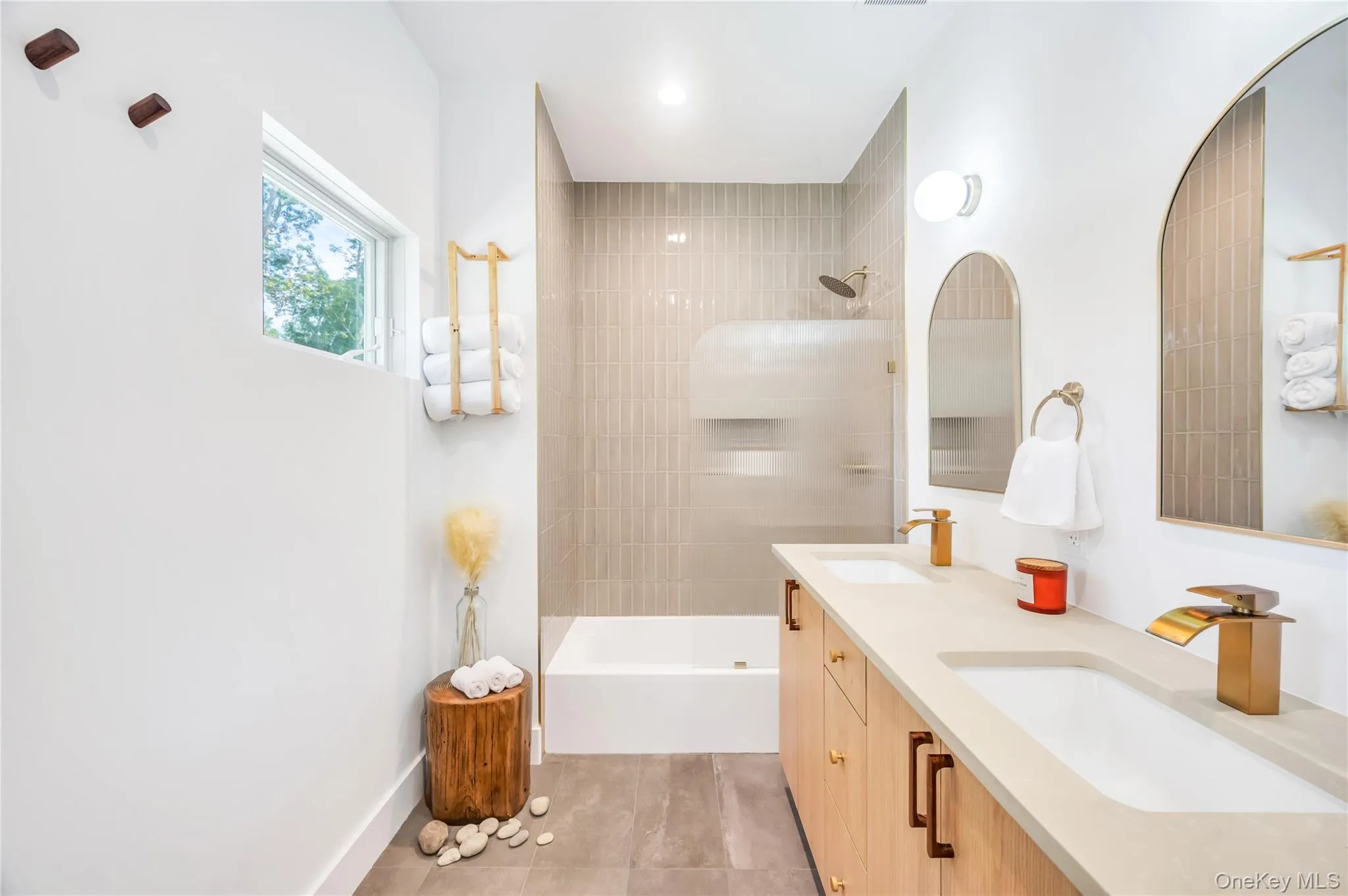 Bathroom featuring double vanity and tub / shower combination Bathroom featuring double vanity and tub / shower combination