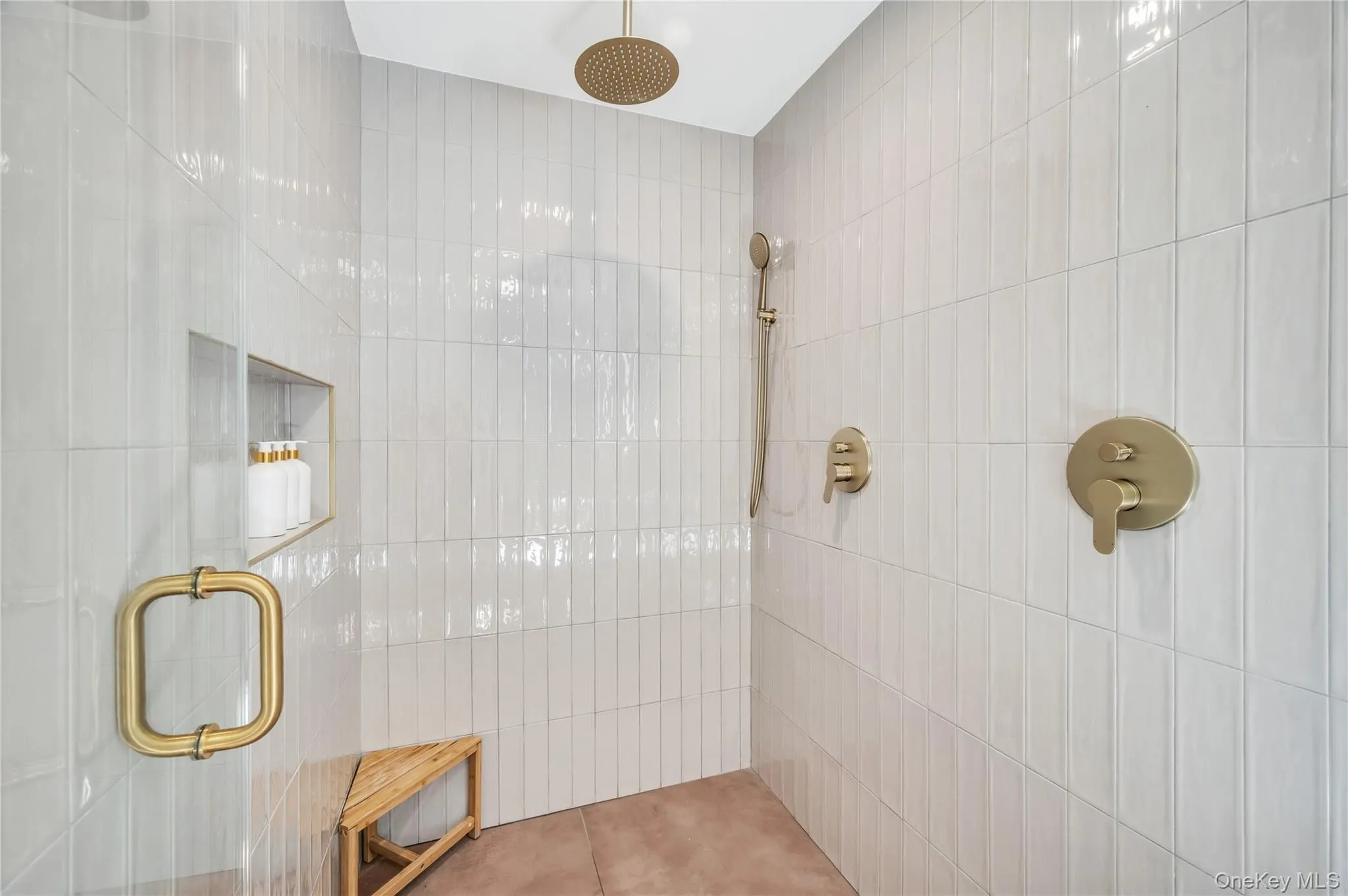 Full bathroom featuring a tile shower Full bathroom featuring a tile shower