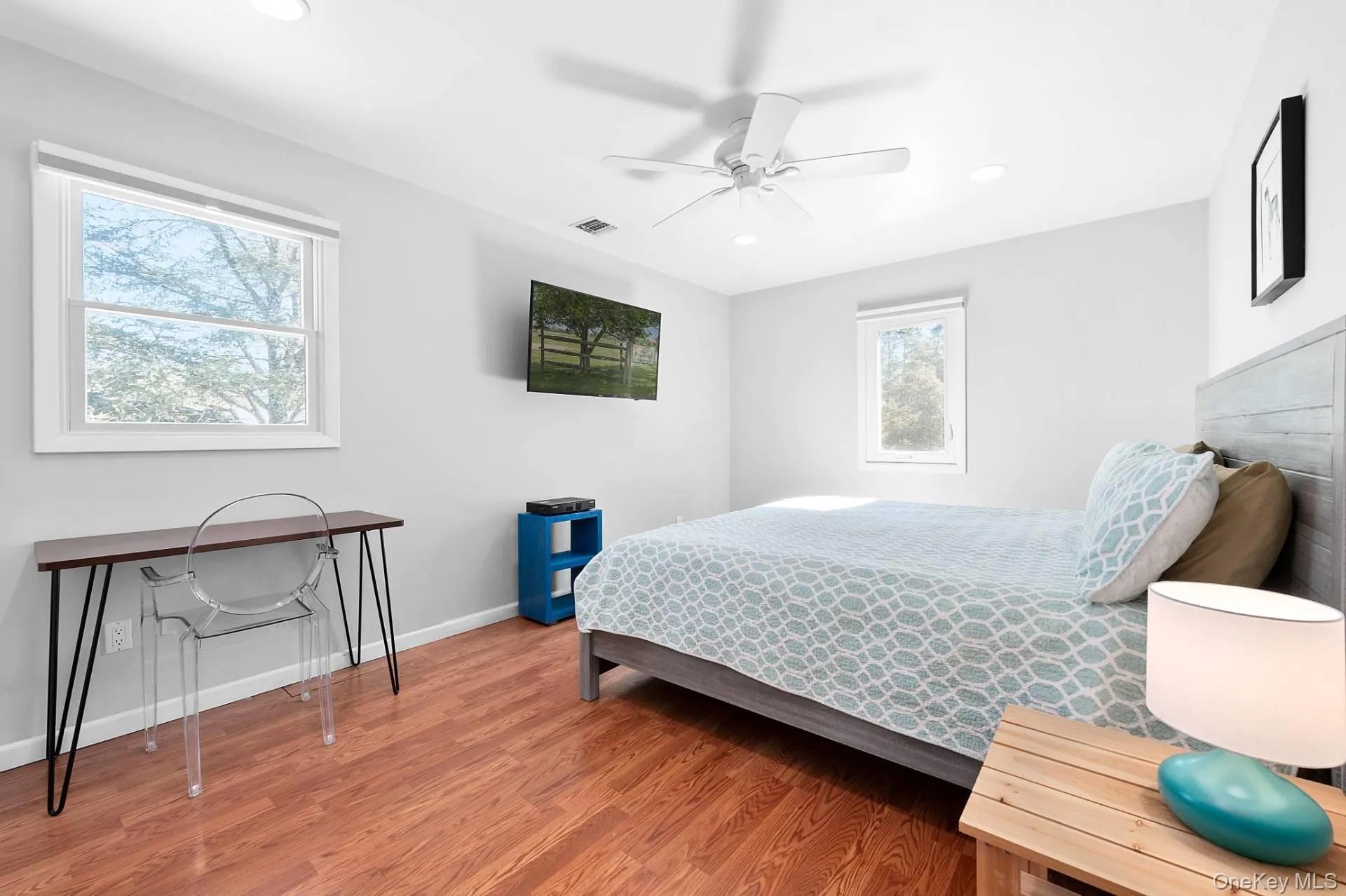 Bedroom with light wood-style floors, a ceiling fan, and recessed lighting Bedroom with light wood-style floors, a ceiling fan, and recessed lighting
