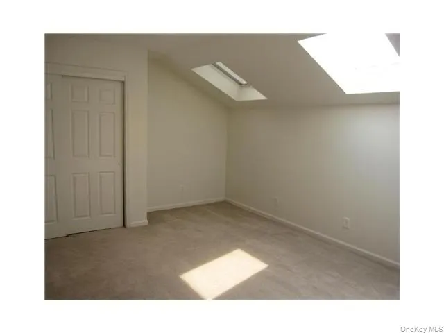 Spacious loft features skylights, a double closet and a door to a private attic area. Spacious loft features skylights, a double closet and a door to a private attic area.