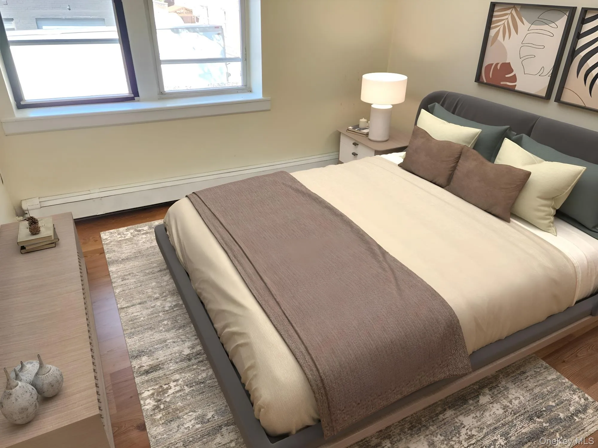 Bedroom with wood finished floors and baseboard heating Bedroom with wood finished floors and baseboard heating