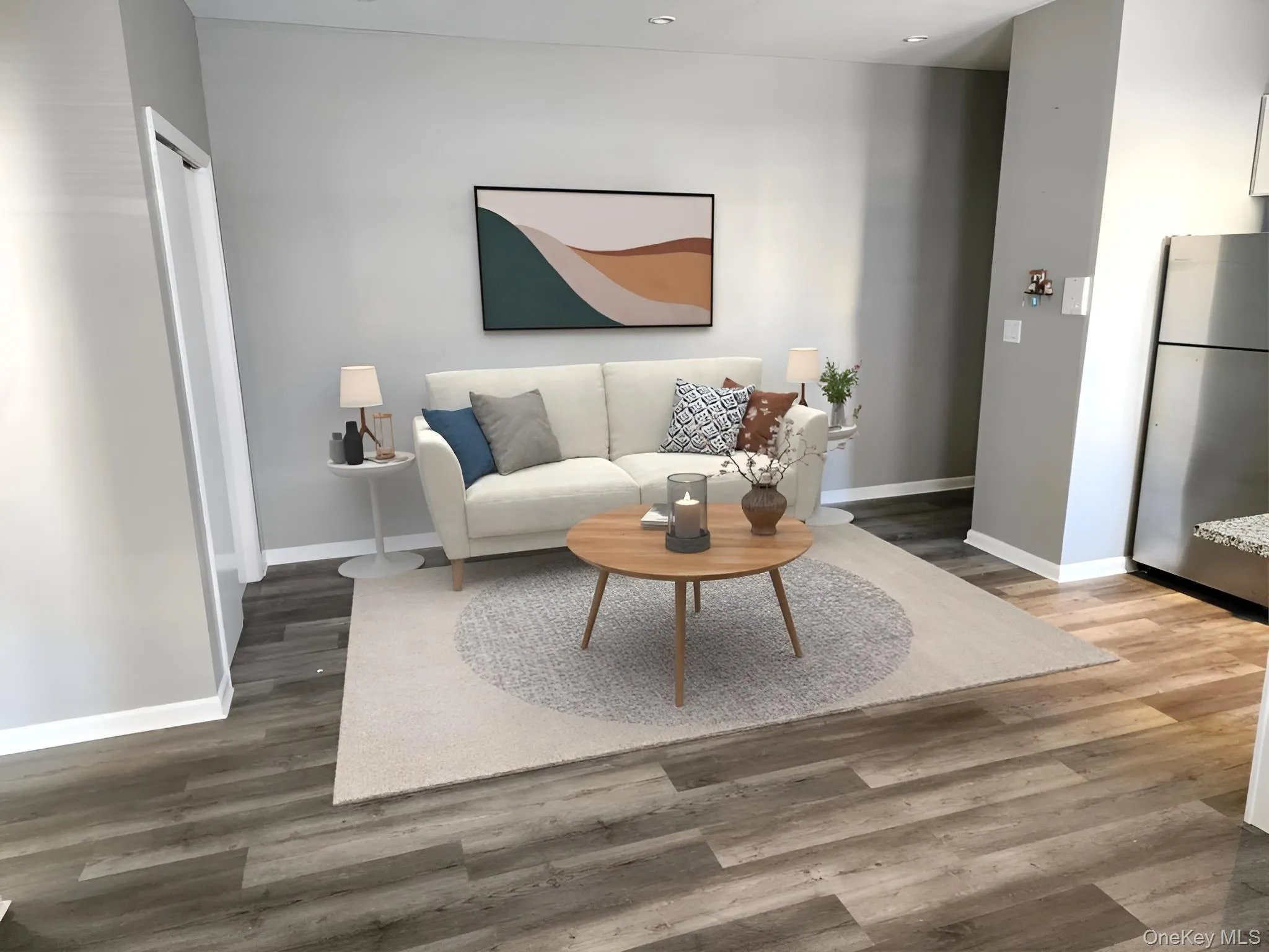 Living room with wood finished floors and baseboards Living room with wood finished floors and baseboards