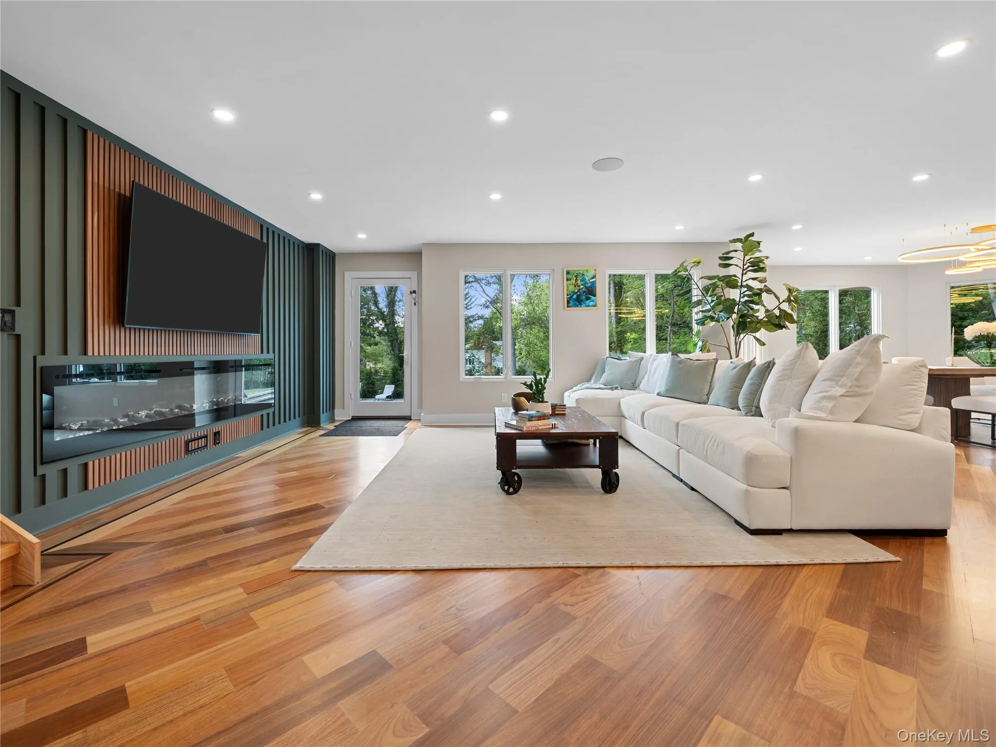 Living area featuring recessed lighting and light wood-type flooring Living area featuring recessed lighting and light wood-type flooring