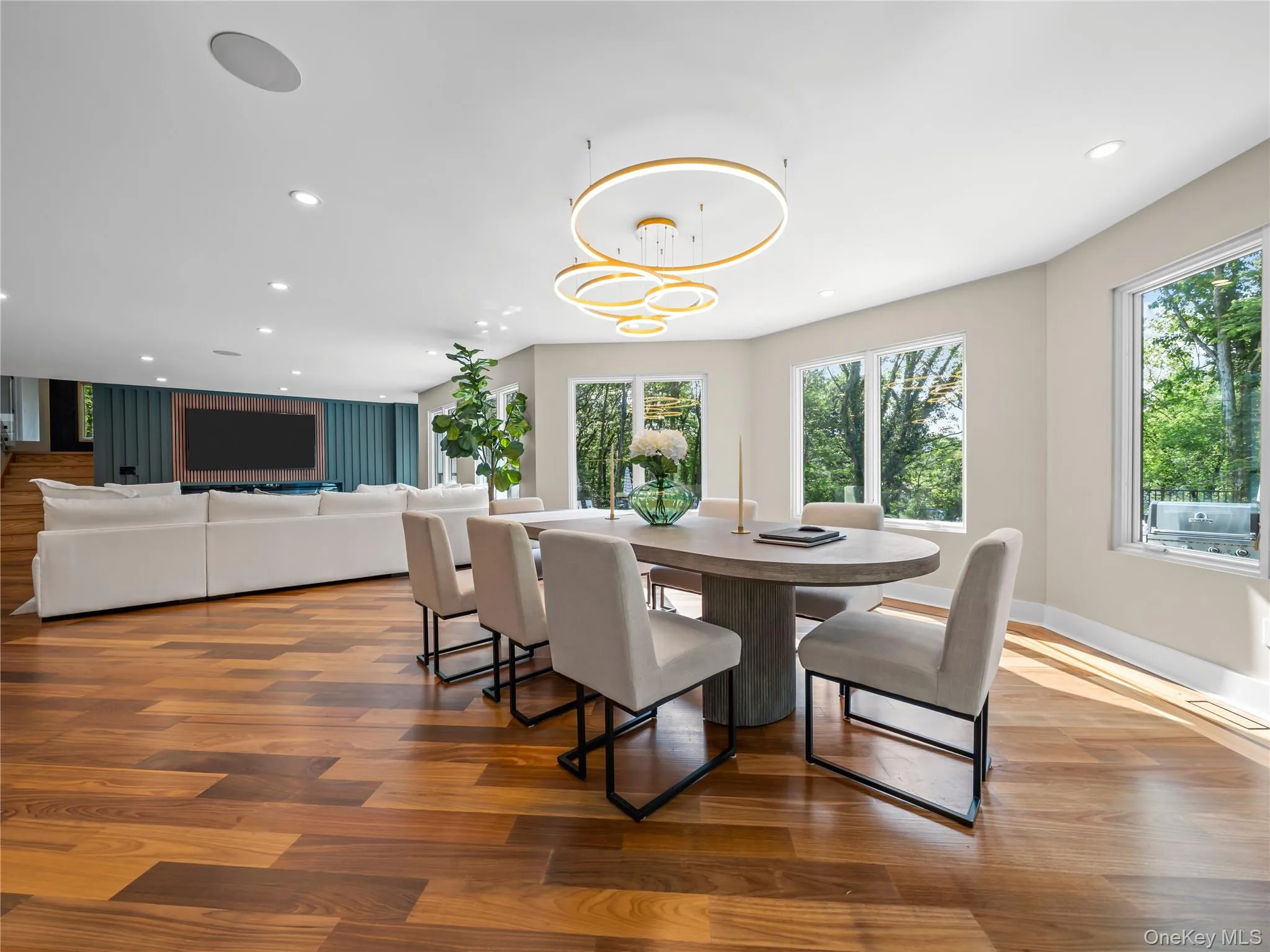 Dining area featuring recessed lighting, wood finished floors, and a chandelier Dining area featuring recessed lighting, wood finished floors, and a chandelier