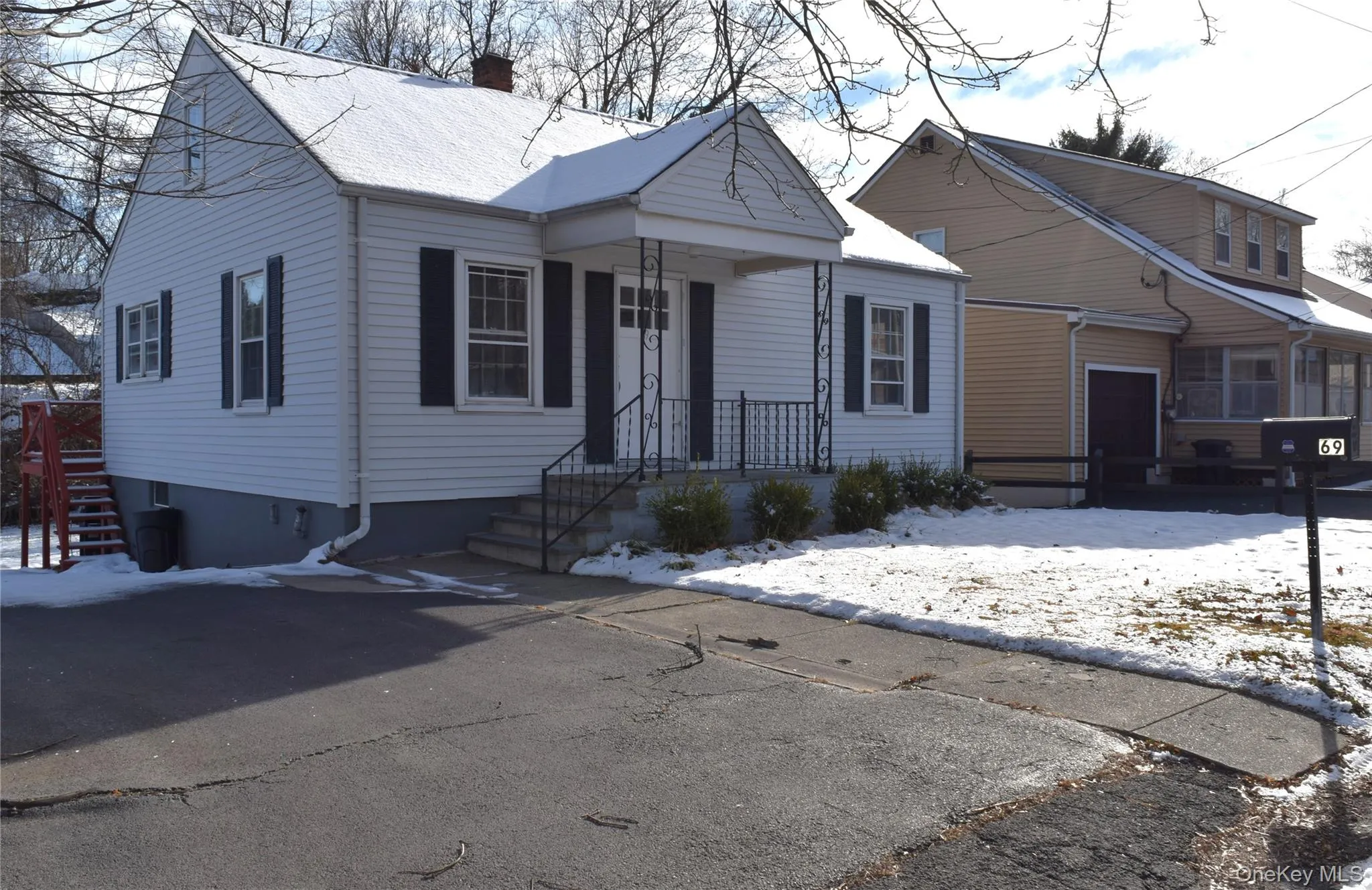 Bungalow-style home with a chimney Bungalow-style home with a chimney