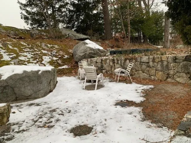 View of yard covered in snow View of yard covered in snow