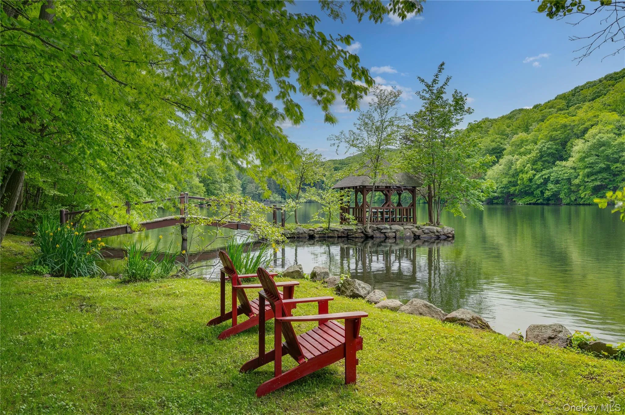 Dock with a yard and a water view Dock with a yard and a water view