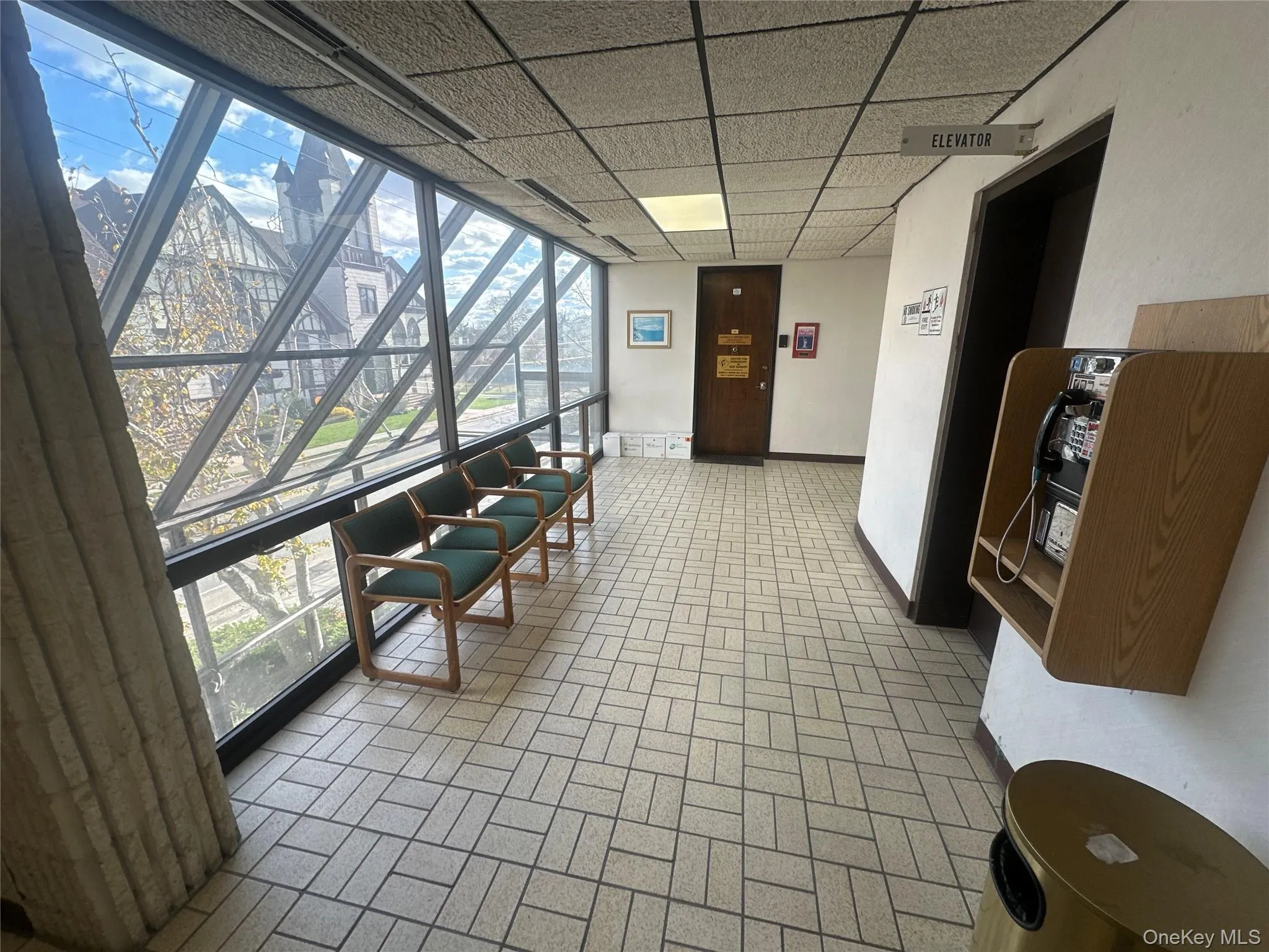 Building lobby featuring a paneled ceiling Building lobby featuring a paneled ceiling