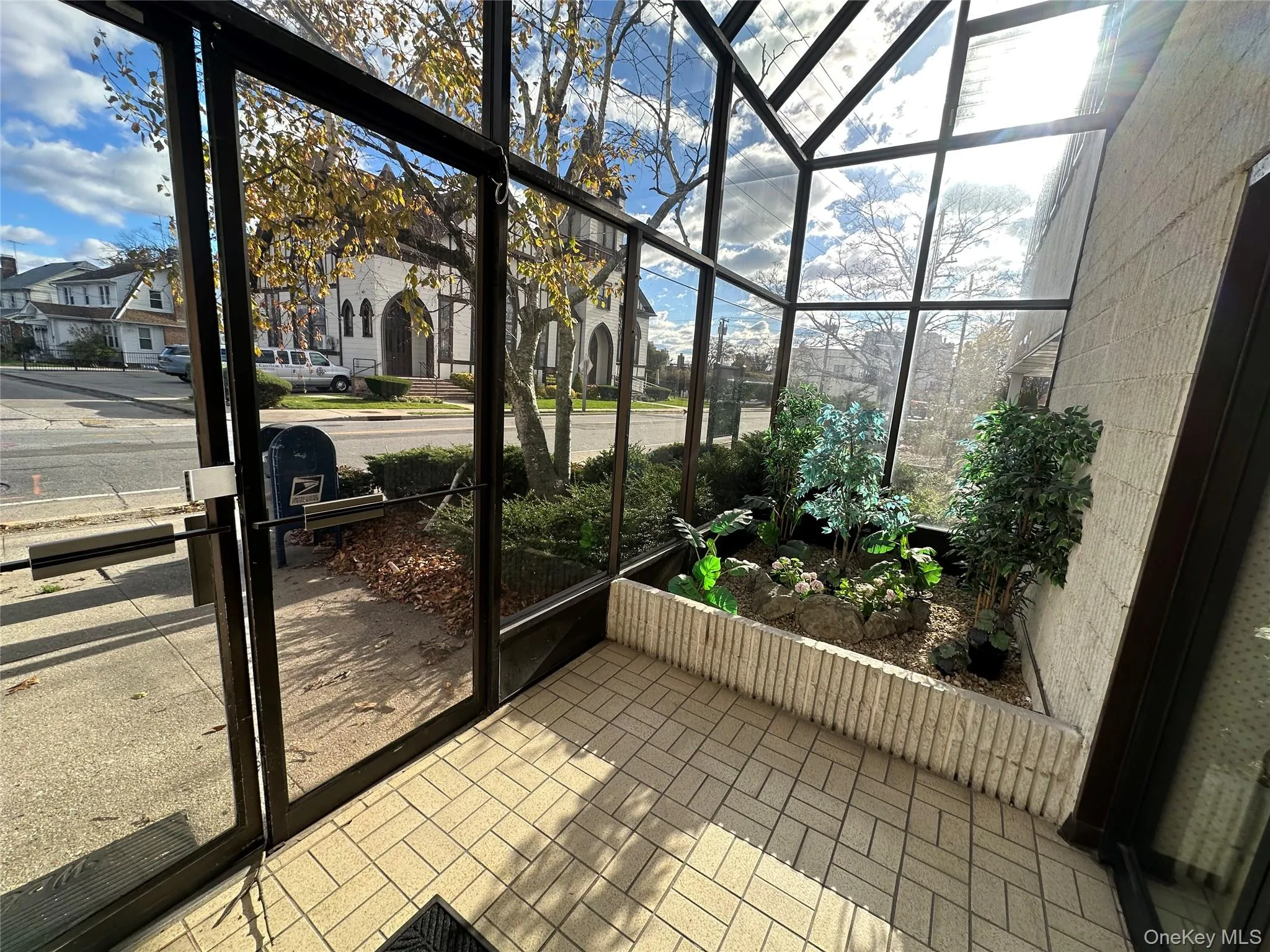 Unfurnished sunroom featuring a residential view Unfurnished sunroom featuring a residential view