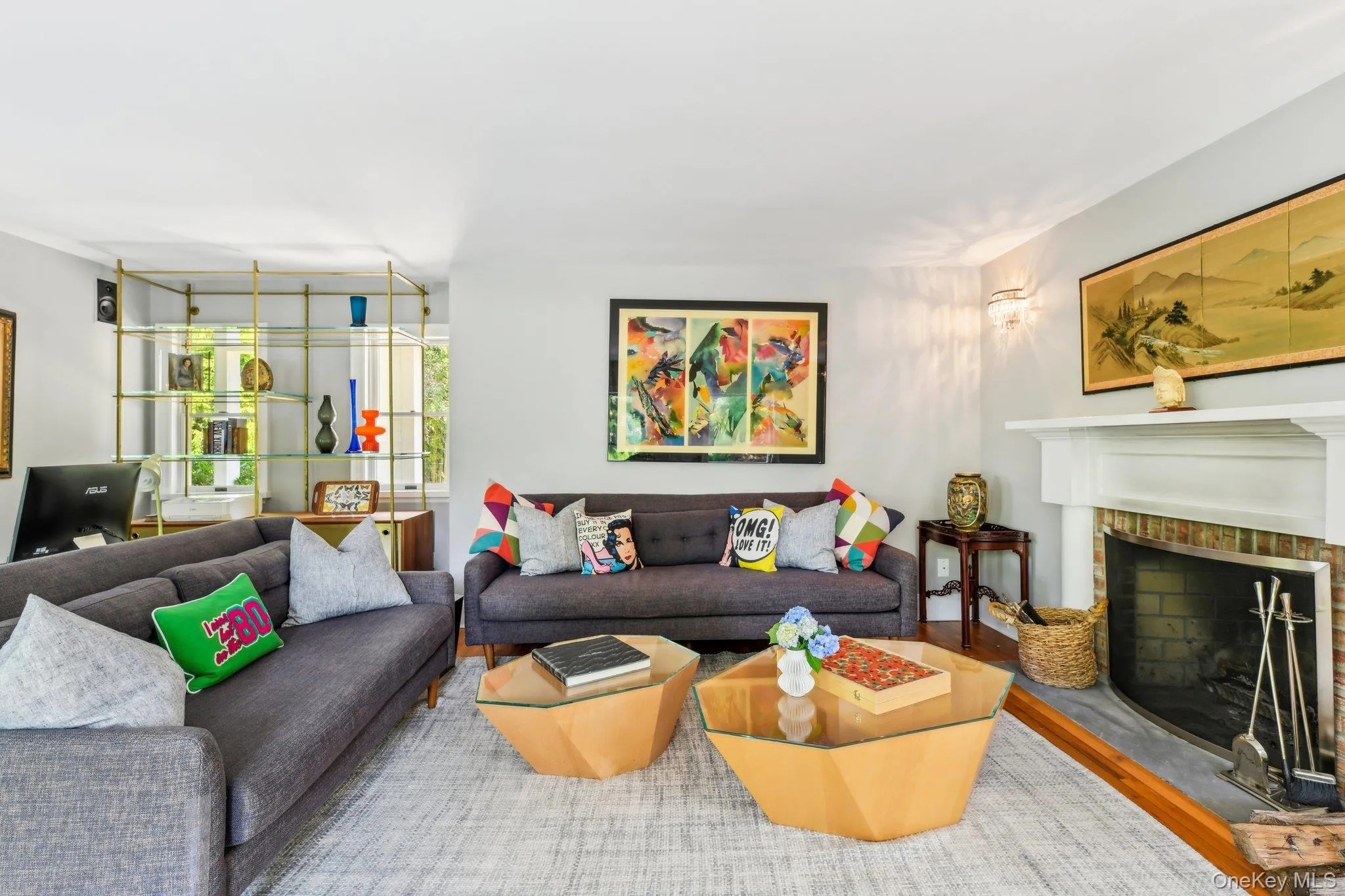 Living room with wood finished floors and a fireplace Living room with wood finished floors and a fireplace