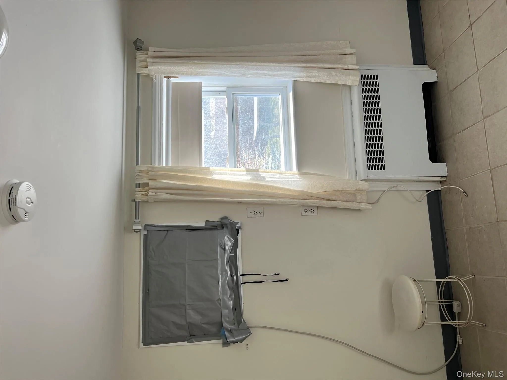 Detailed view of radiator heating unit and a smoke detector Detailed view of radiator heating unit and a smoke detector