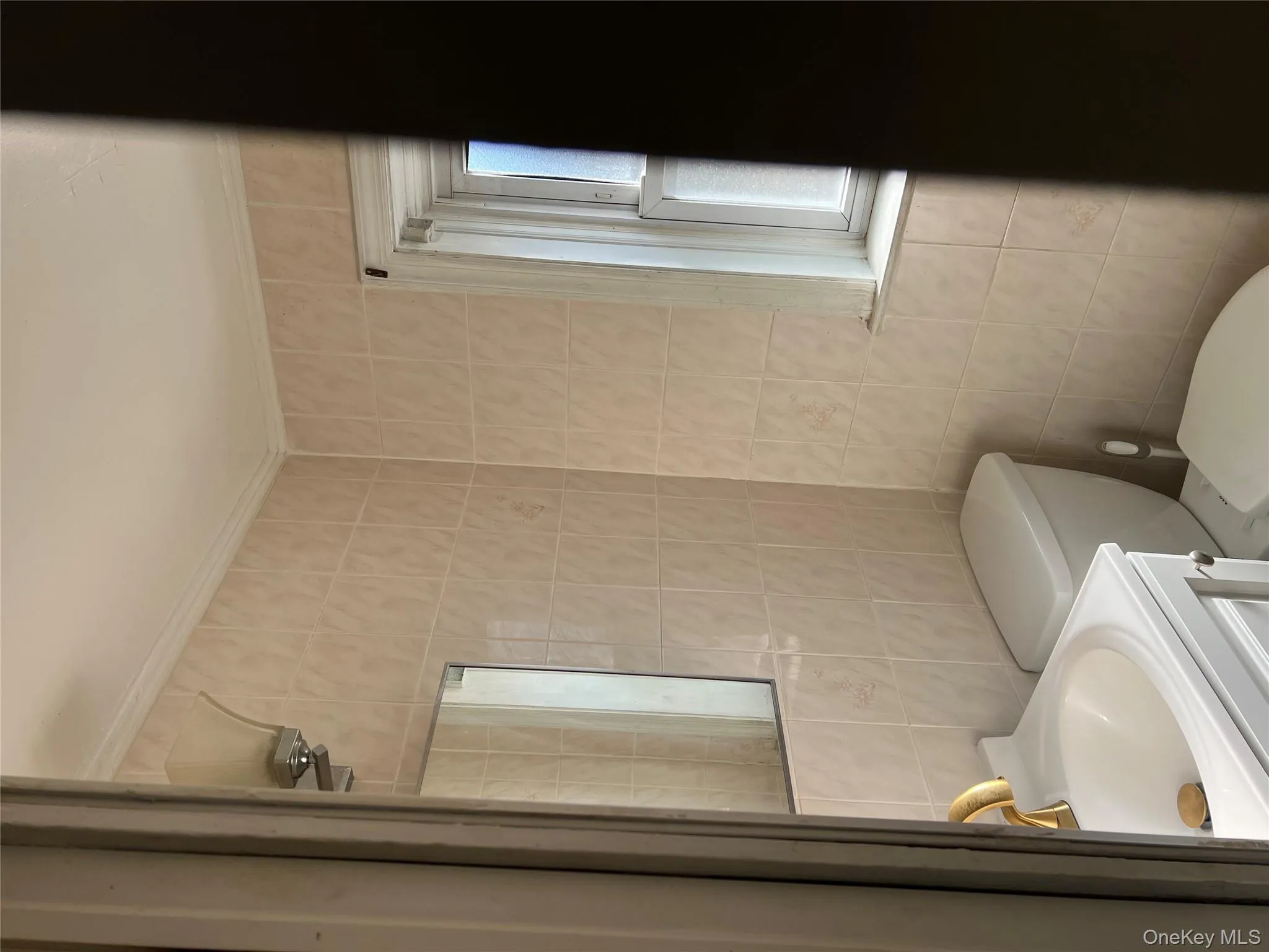 Half bath with tile walls and vanity Half bath with tile walls and vanity