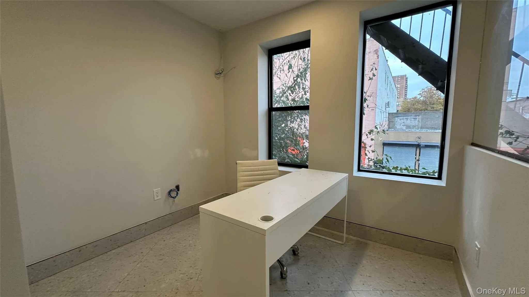 Unfurnished office with baseboards Unfurnished office with baseboards