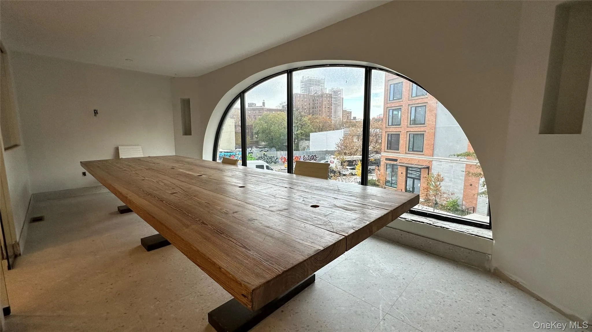 Dining space with a view of city and baseboards Dining space with a view of city and baseboards
