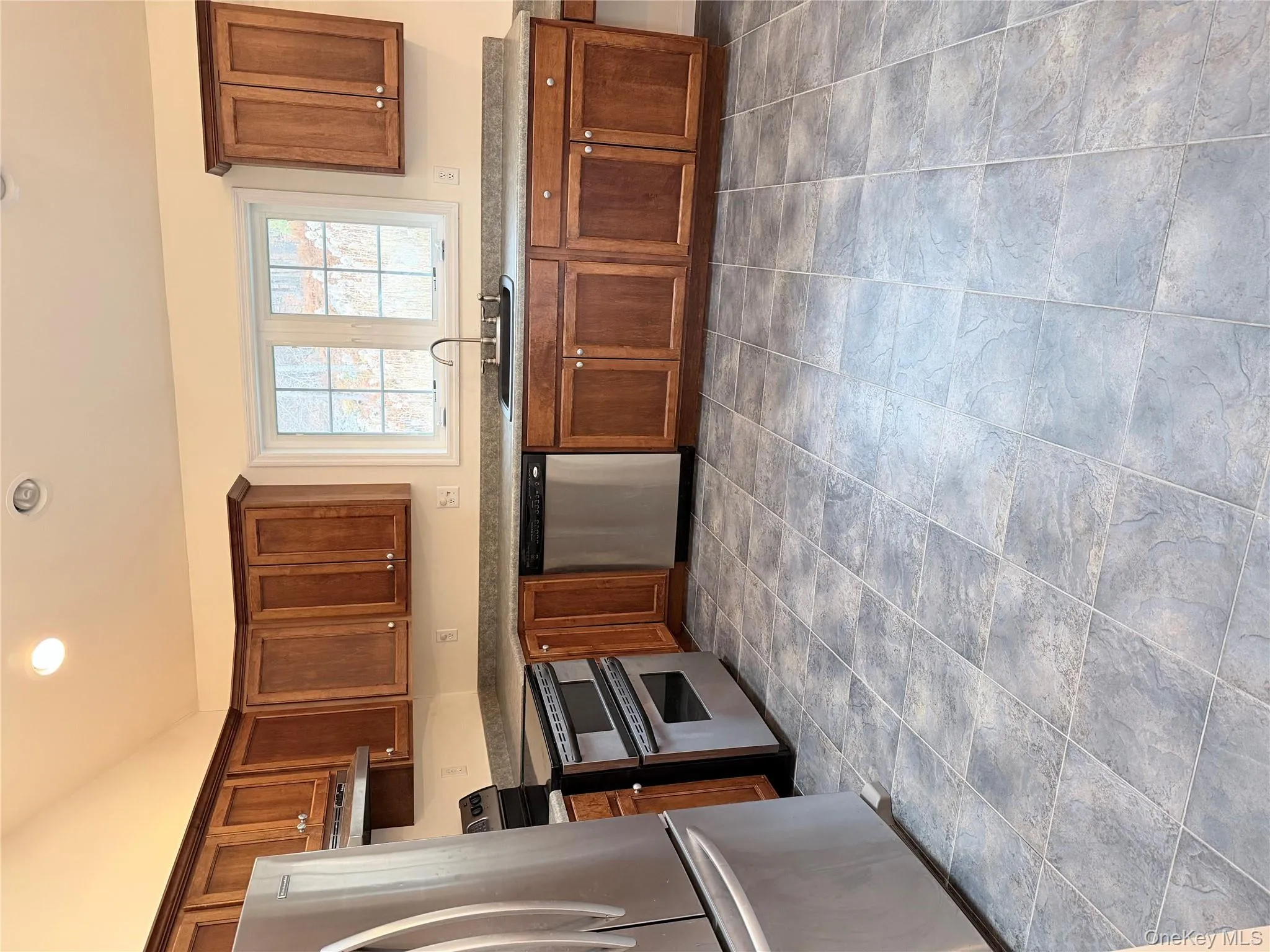 Kitchen featuring fridge, range, dishwasher, ventilation hood, and recessed lighting Kitchen featuring fridge, range, dishwasher, ventilation hood, and recessed lighting