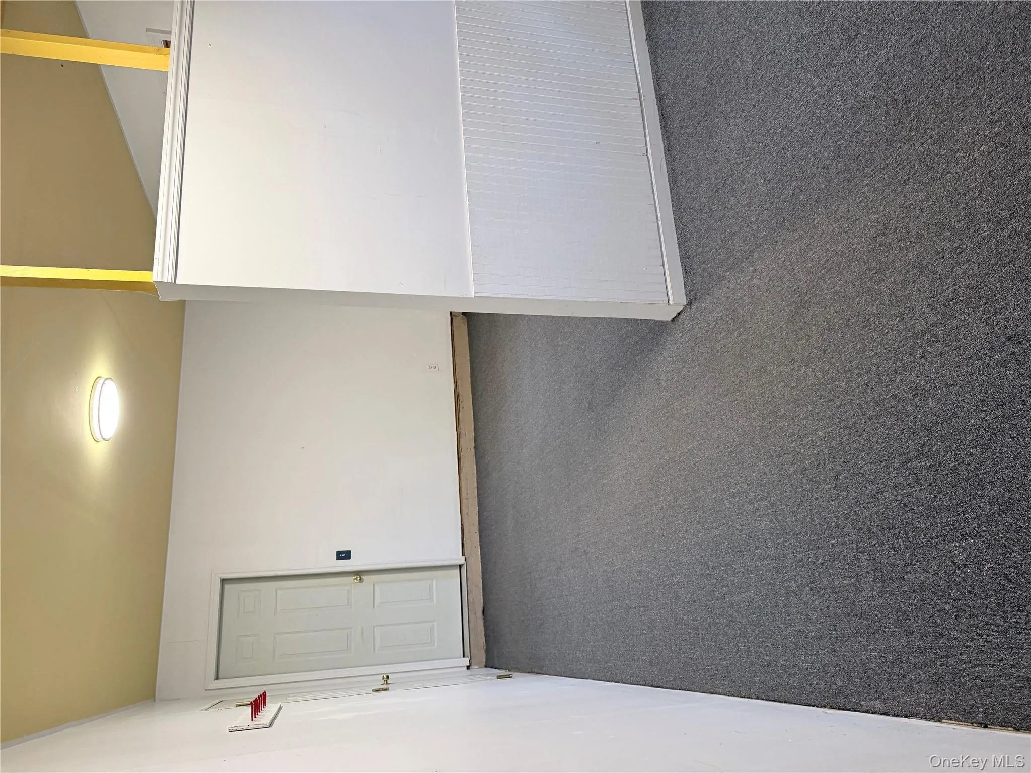 Spare room featuring dark colored carpet Spare room featuring dark colored carpet