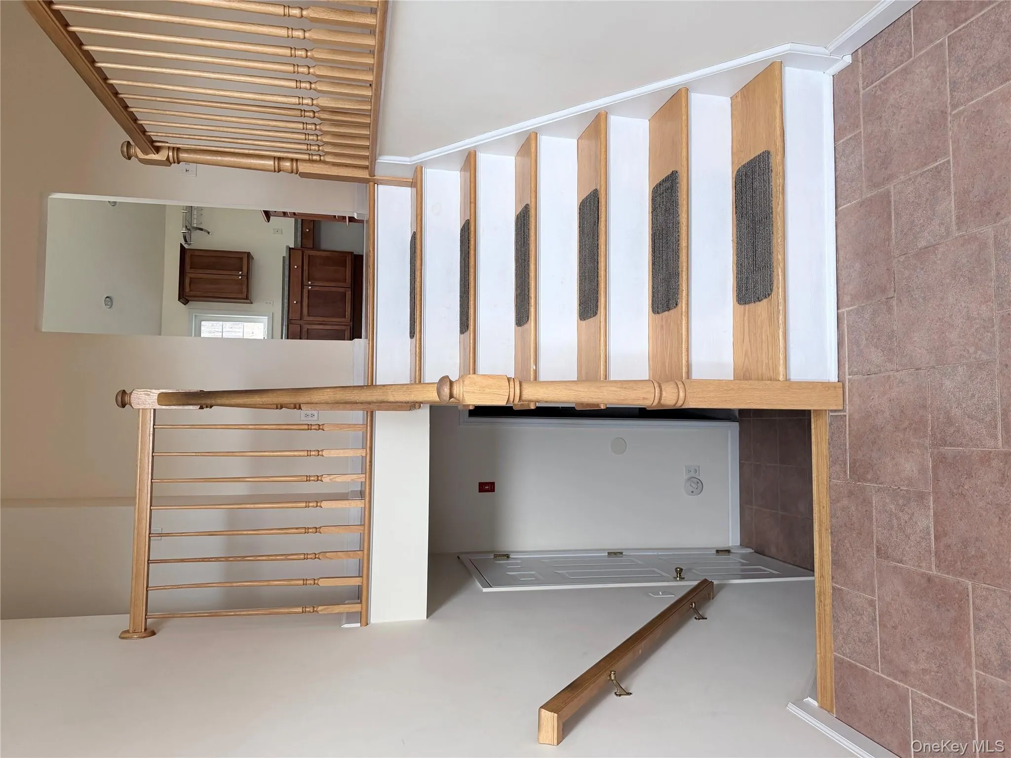 Stairway featuring baseboards Stairway featuring baseboards