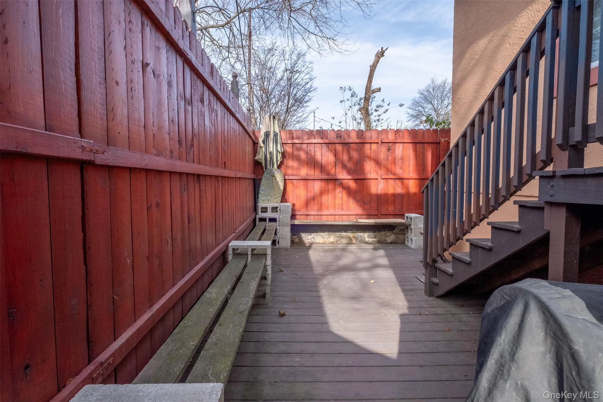 Wooden deck with a fenced backyard Wooden deck with a fenced backyard