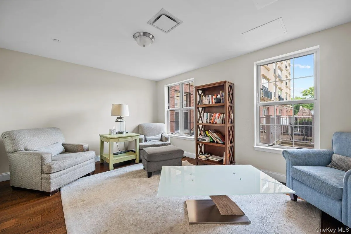 Sitting room featuring wood finished floors and baseboards Sitting room featuring wood finished floors and baseboards