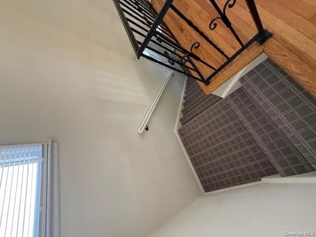 Stairway featuring baseboards Stairway featuring baseboards