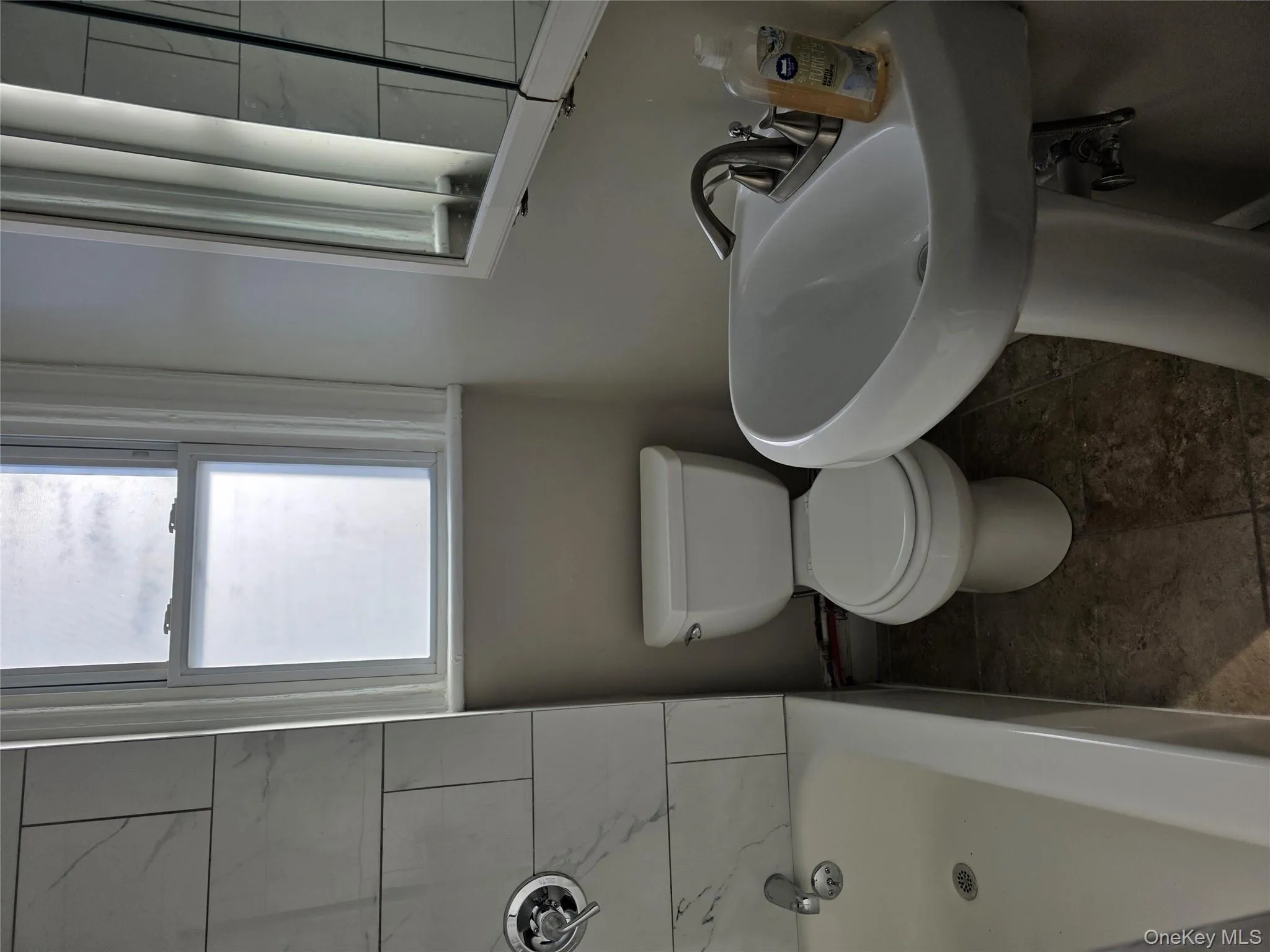 Full bath with toilet and shower / bathtub combination Full bath with toilet and shower / bathtub combination